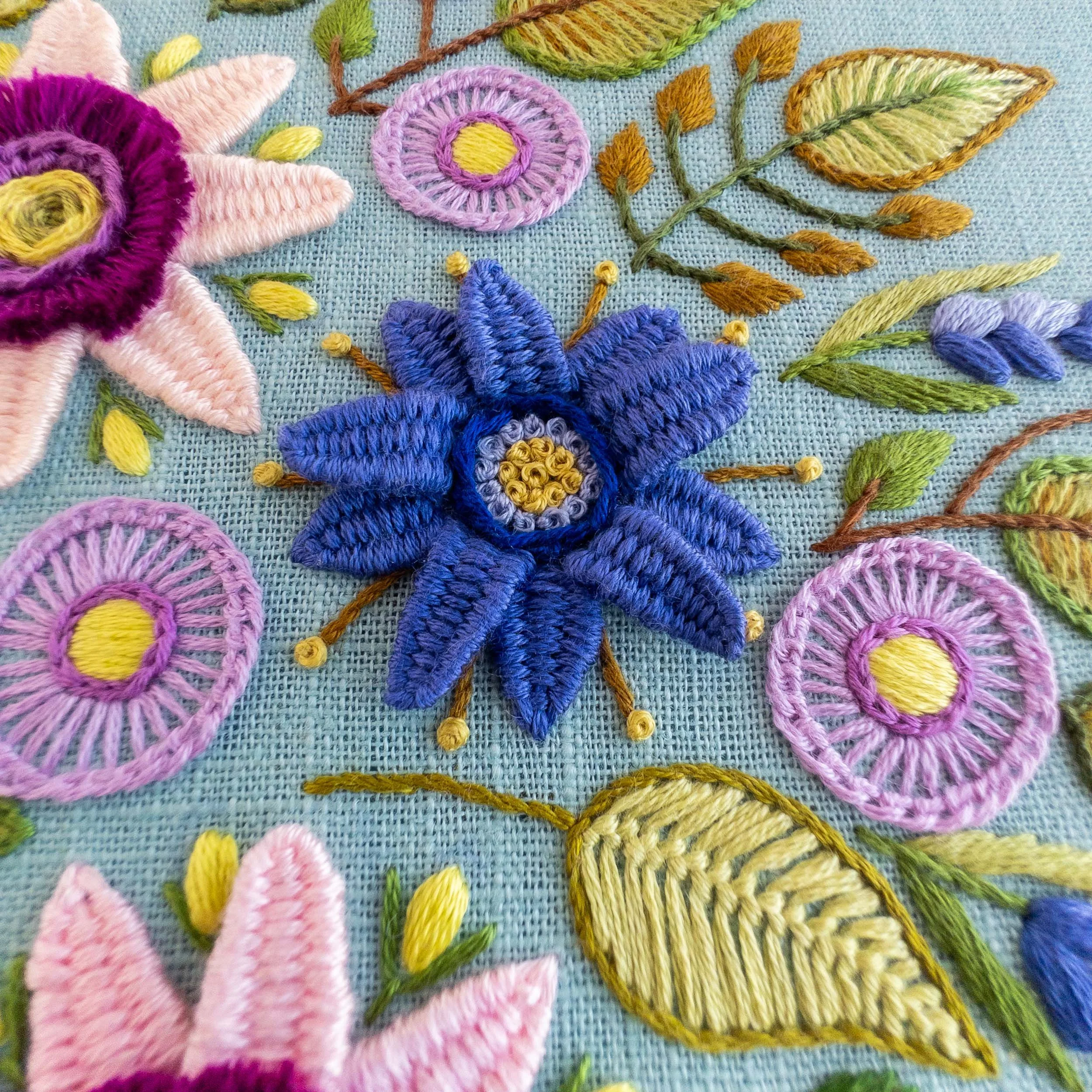 the-hoop-in-hand-floral-hedgehog-embroidery-close-up-blue-flower.jpg