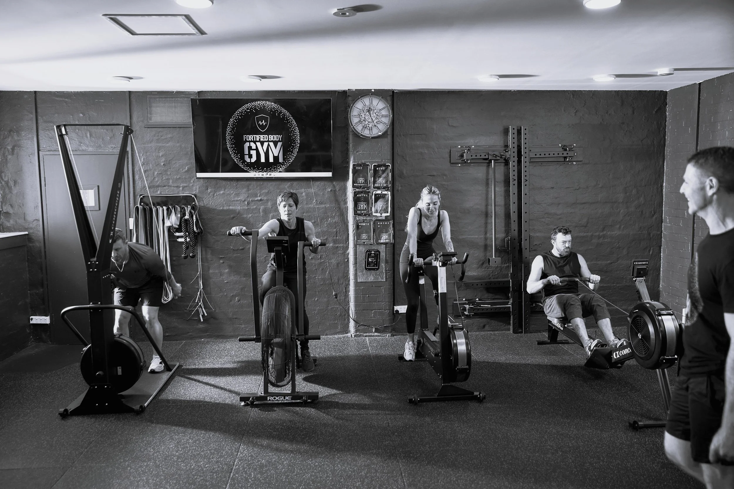 Members exercising on conditioning equipment