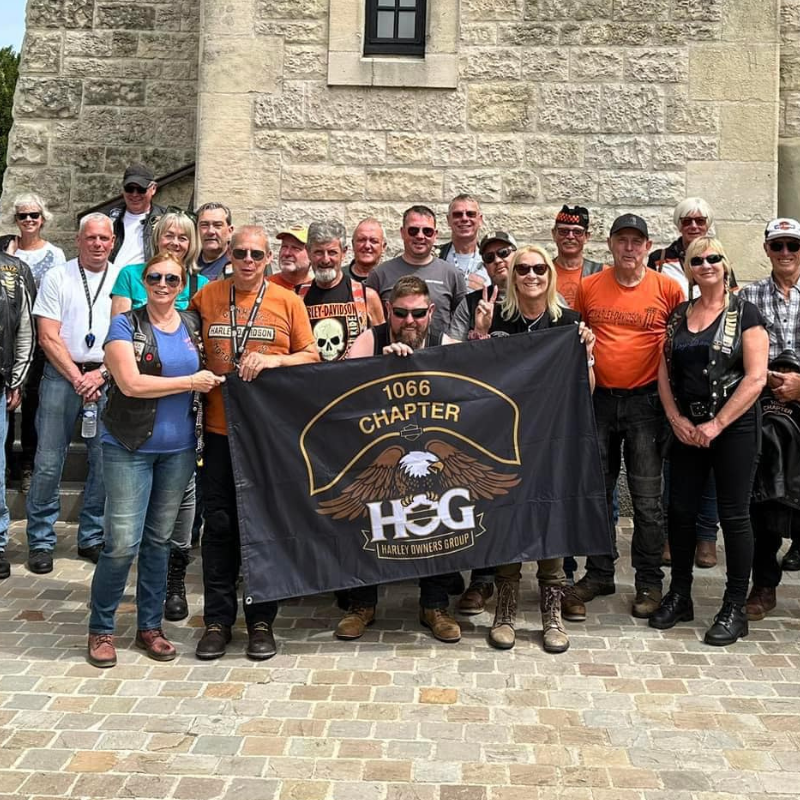 1066 Chapter members group photo holding banner