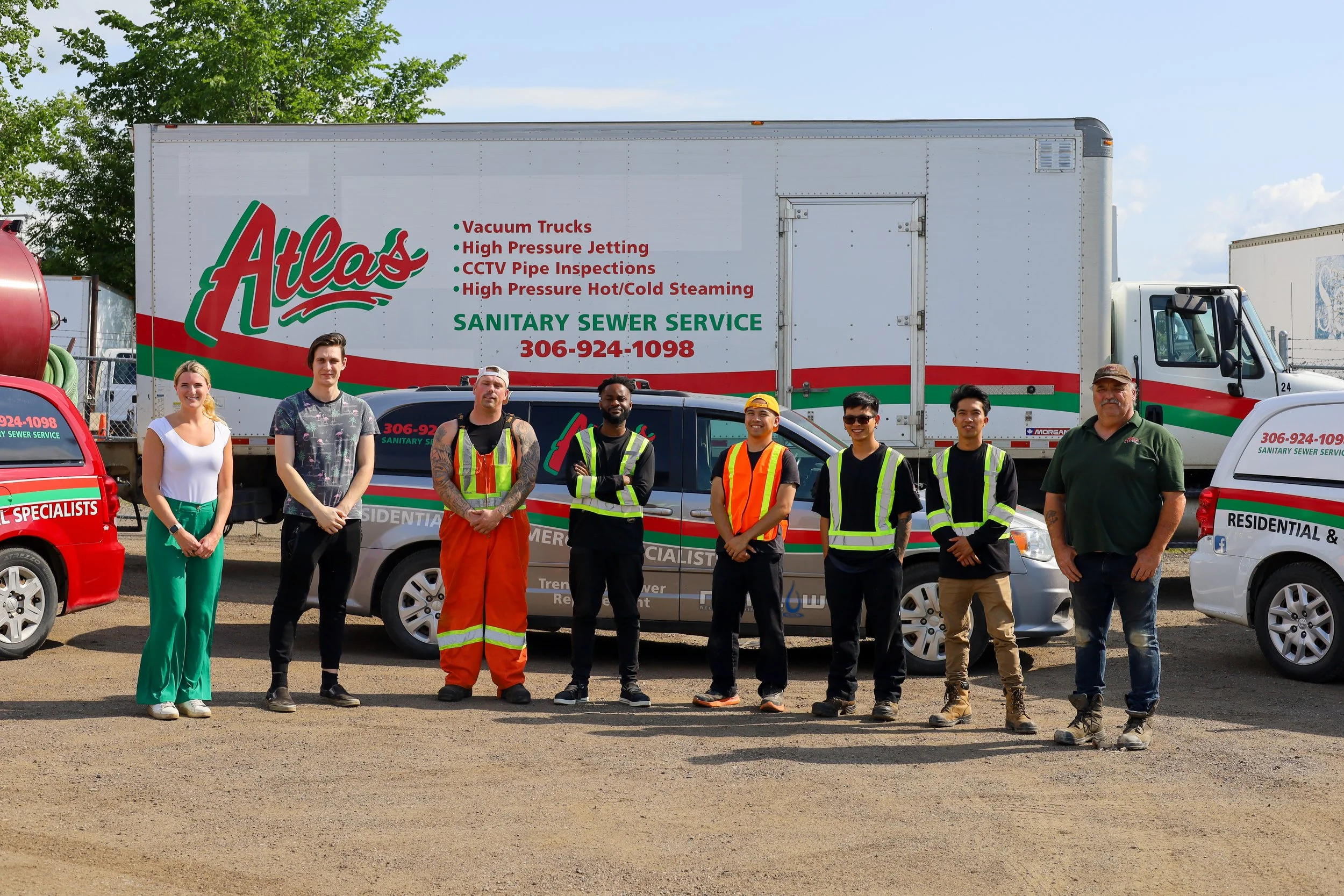 Technician using emergency equipment to clear blocked residential sewer line in Regina.