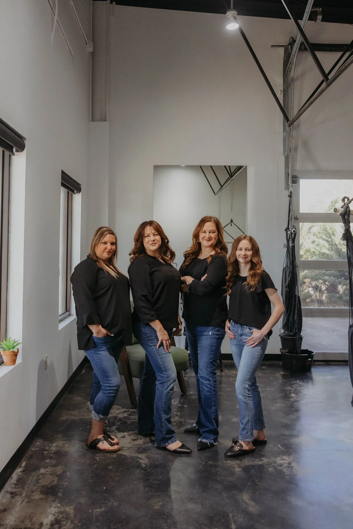 Four Thrive team members standing together in the office.