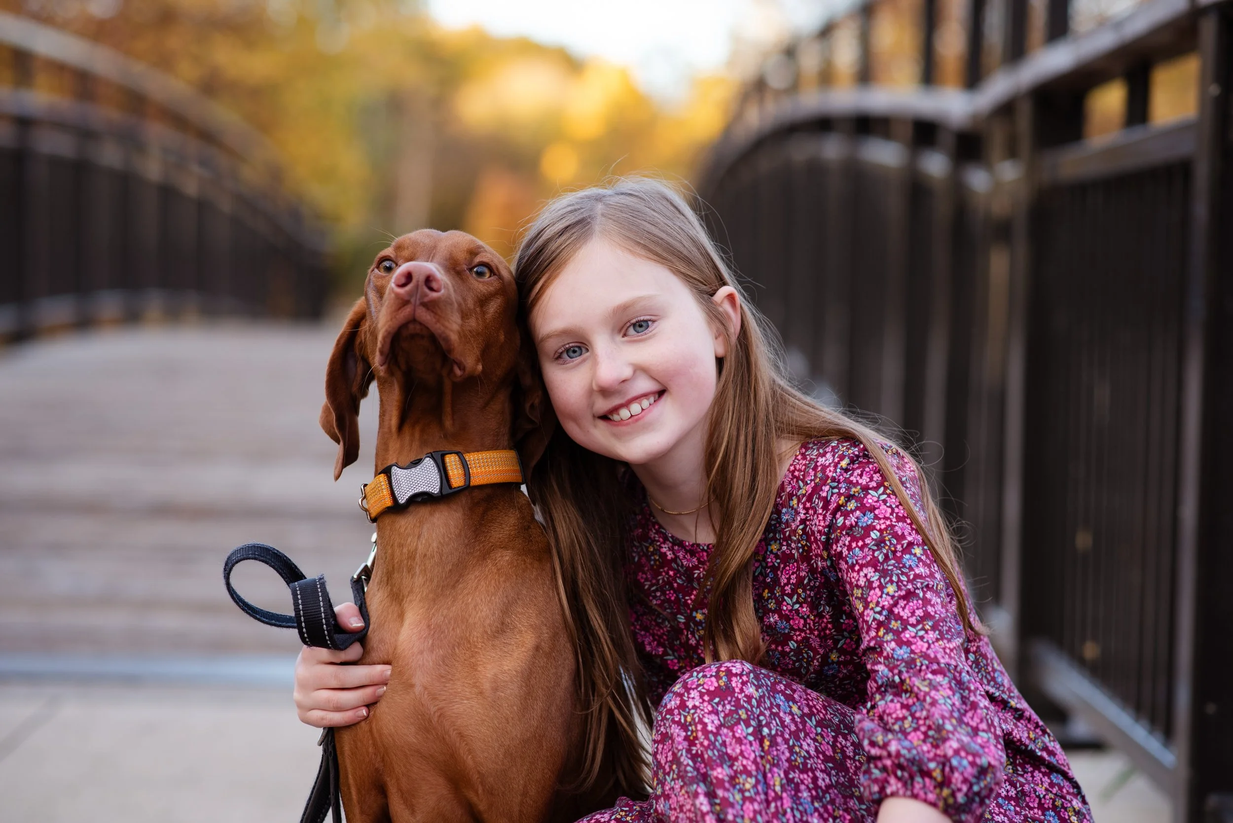 young girl posing with her dog
