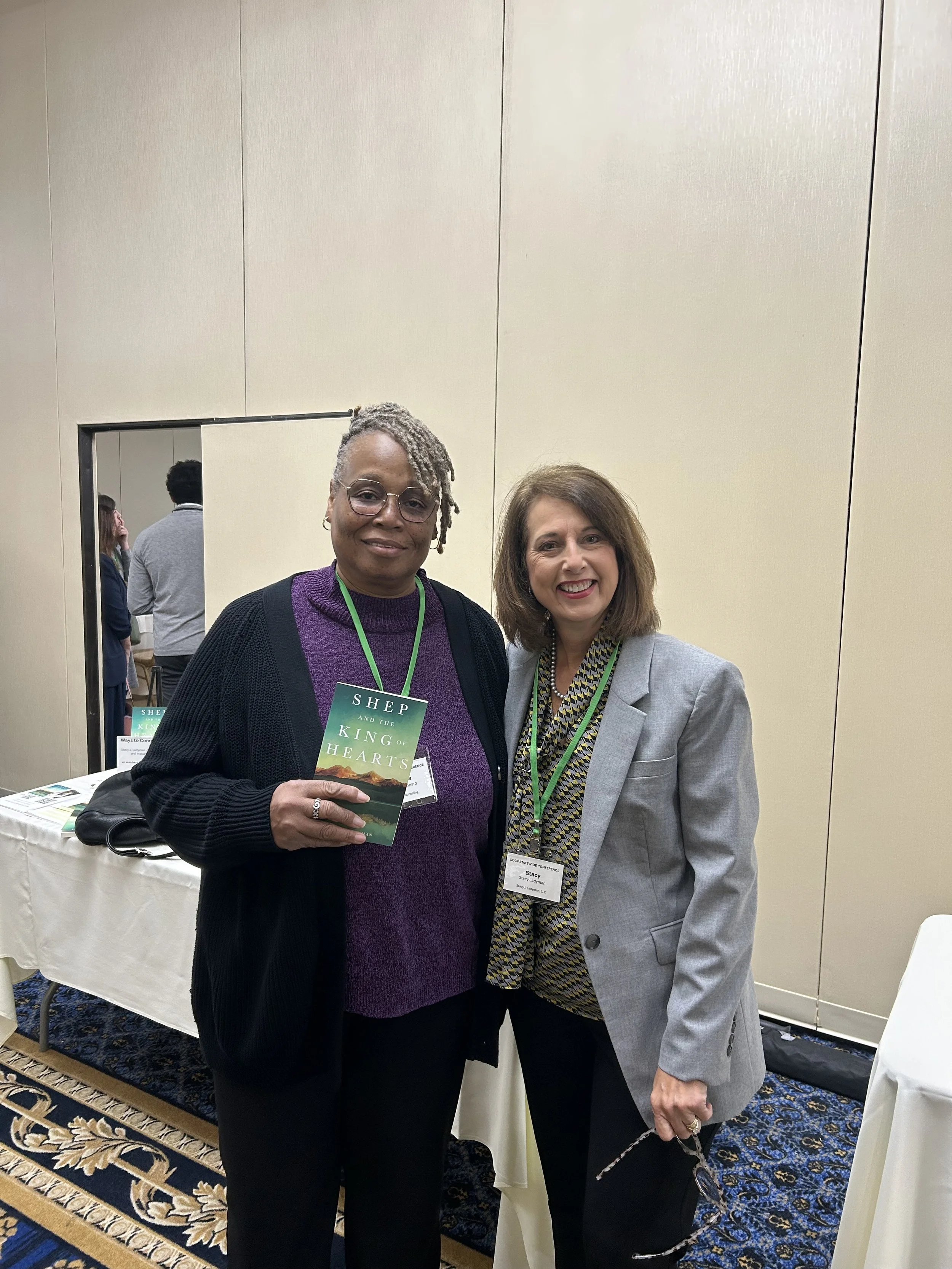 Stacy J. Ladyman and a woman holding Shep and the King of Hearts book.