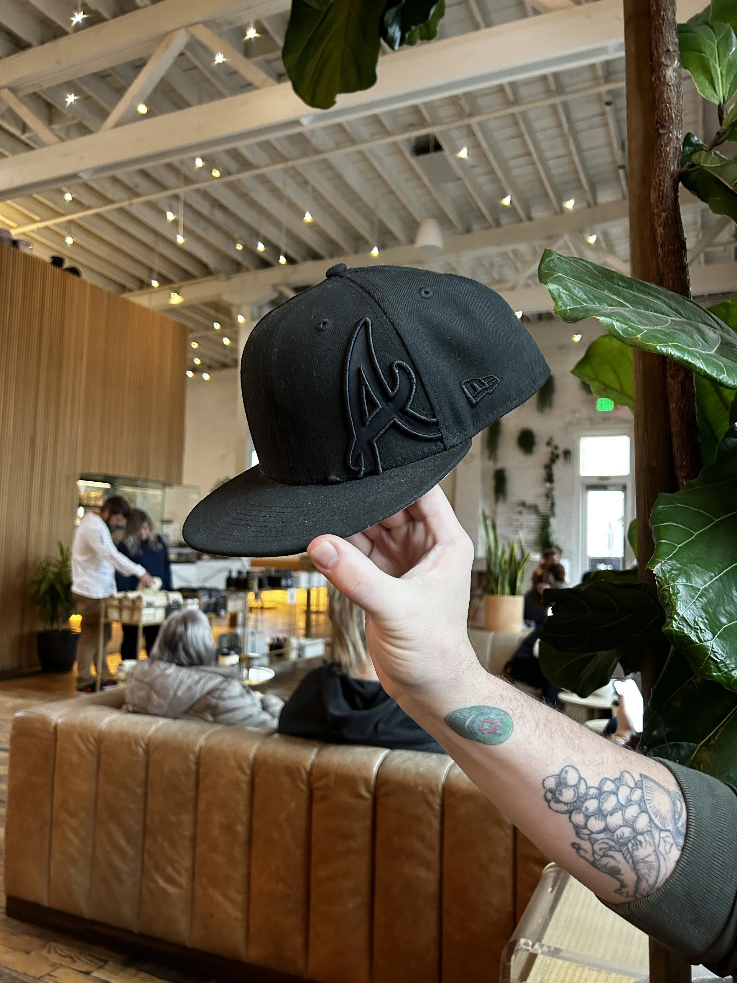 Chef Aaron Walters wanted Templeton's to be a symbol of his culinary journey. He is known for his signature snapback hats, which became an important piece of the branding.