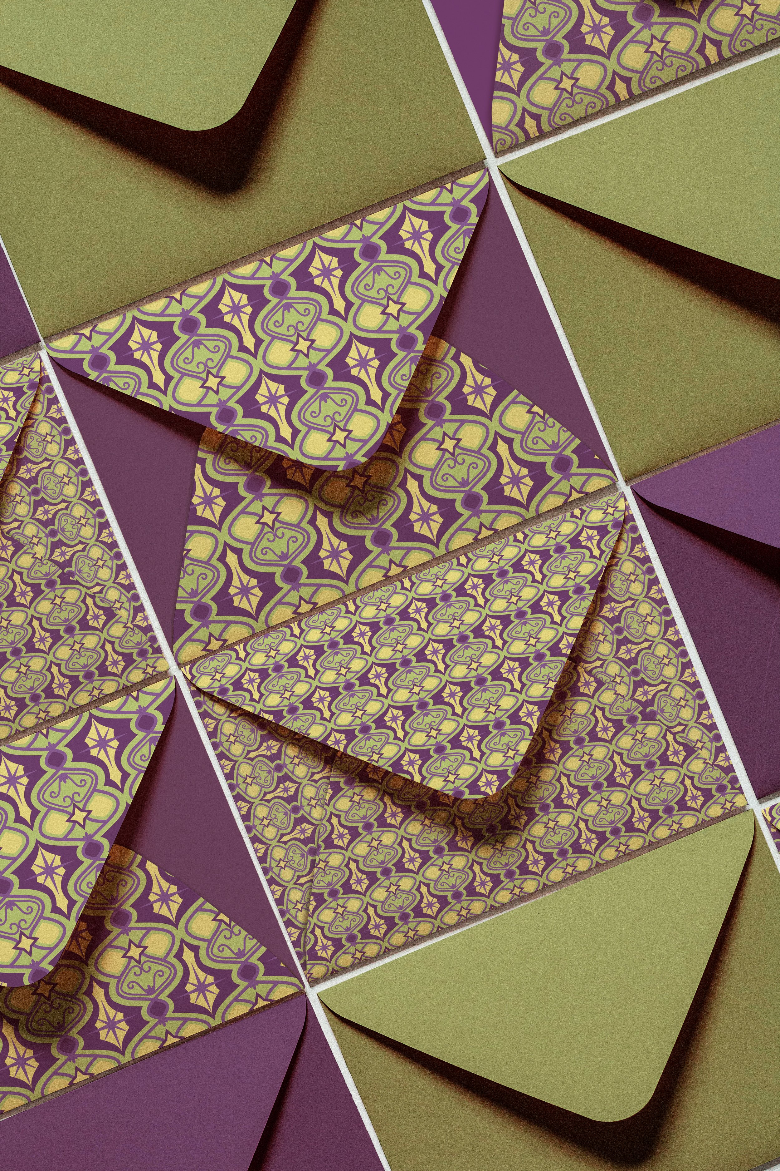 This mock set of envelopes incorporates the pattern and colors in various iterations.