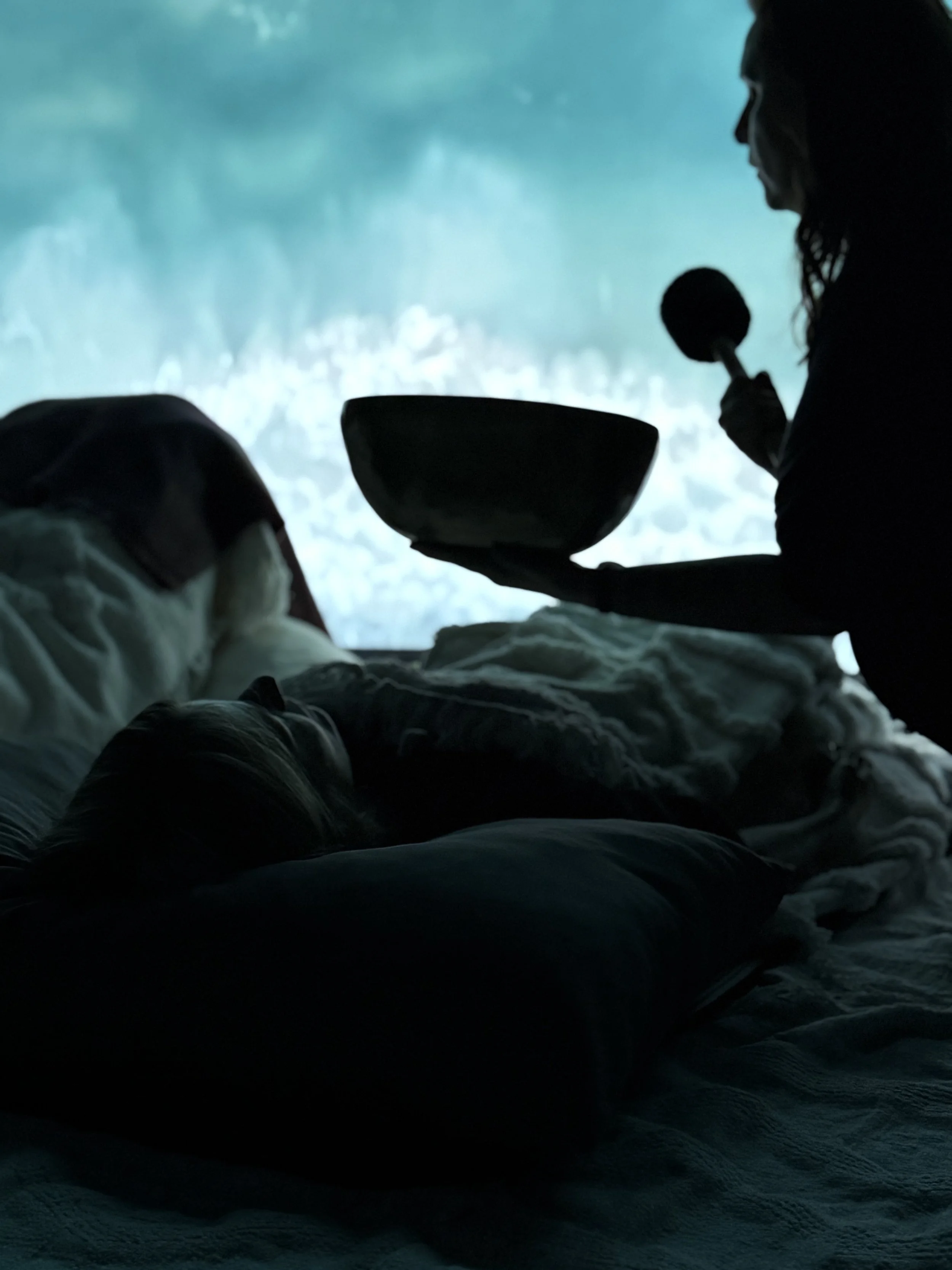 Woman receiving sound healing at The Wild Spirit Massage and Wellness Studio in Mission B.C. Canada