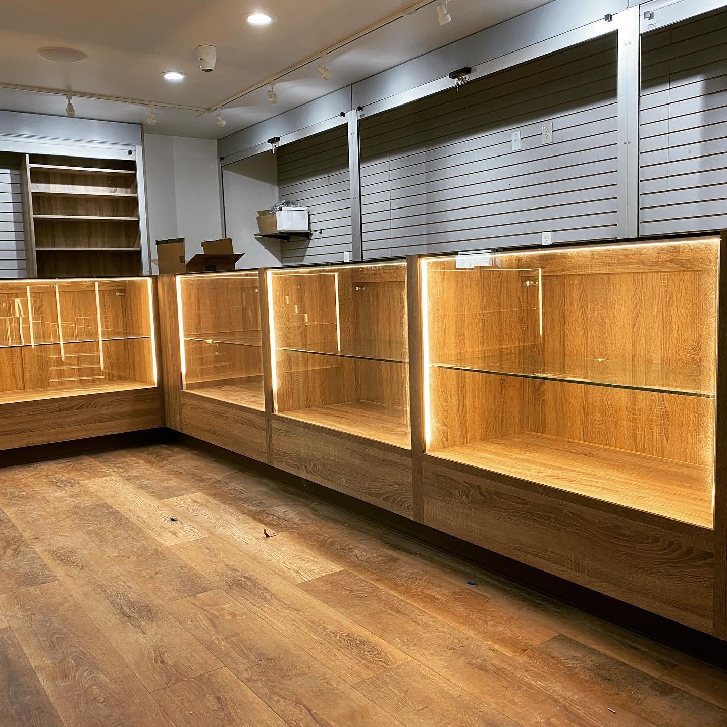 Just wrapped up this retail space. Display cases with glass shelving and built in lighting, along with some built in office furniture.