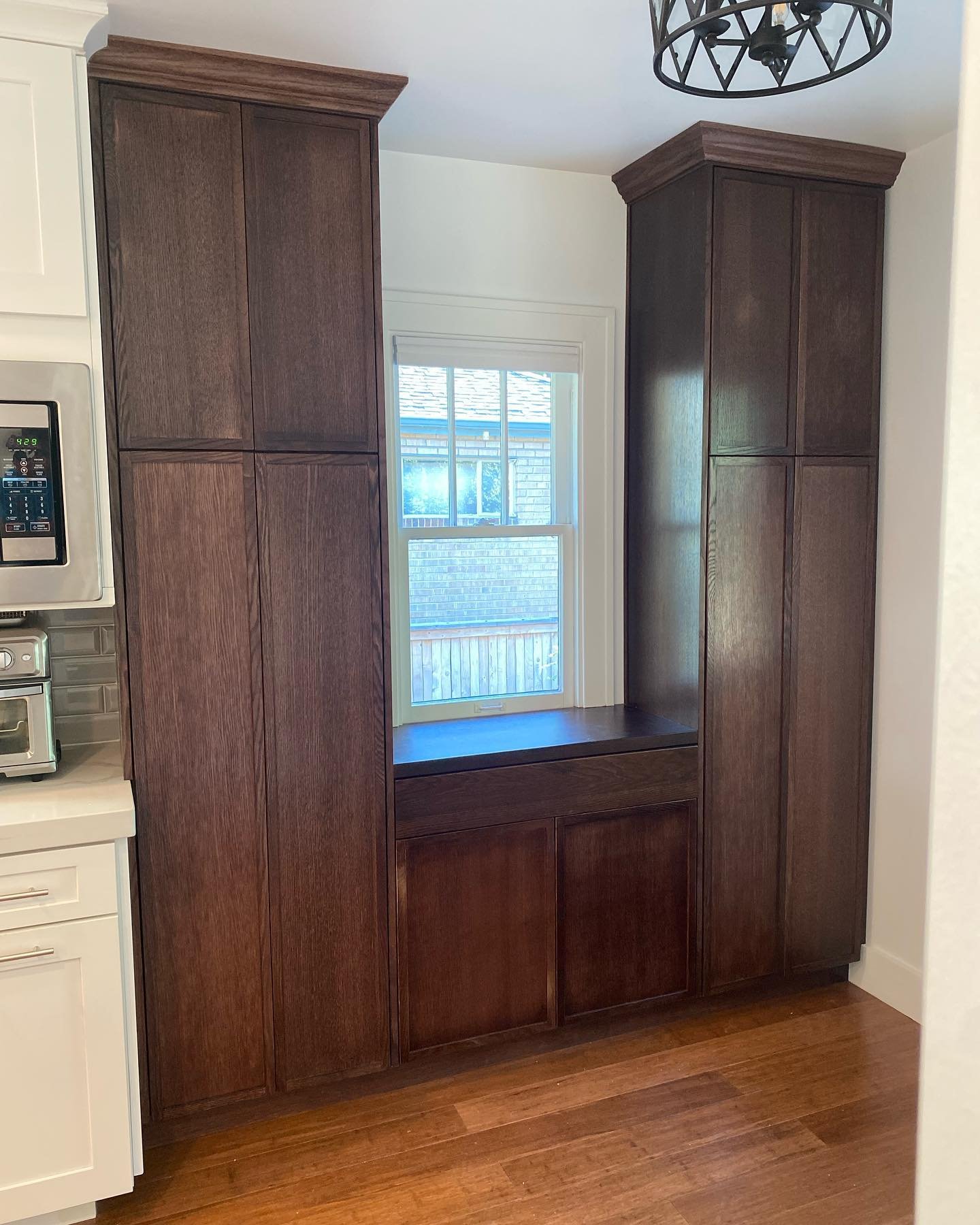 White Oak pantry, with a painted breakfast nook banquette.