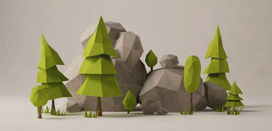 Paper craft model of a forest scene with green polygonal trees, rocks, and small bushes.