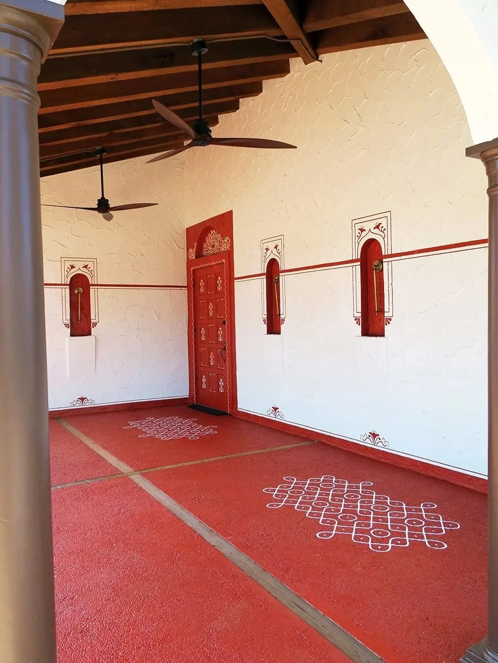 Southern indian restaurant mural art entry for placemaking and celebrating culture. Traditional architectural features and kolams. SF Bay Area mural artist interior design portfolio & inspiration.