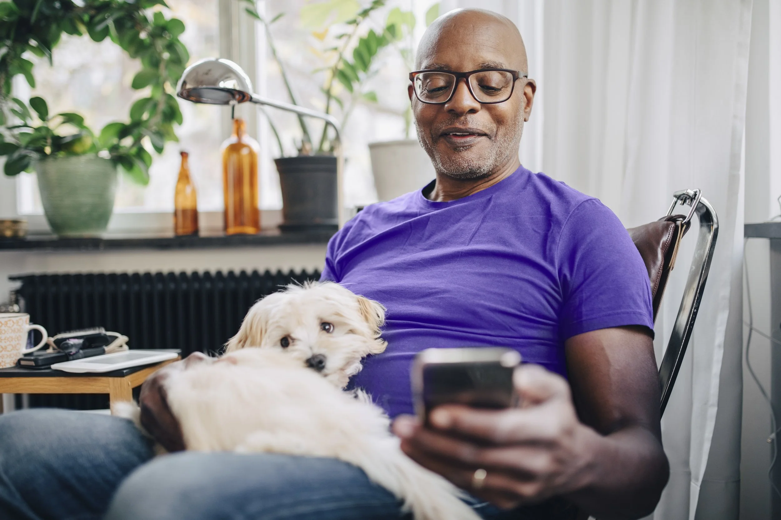 Man with Phone and Dog.jpg