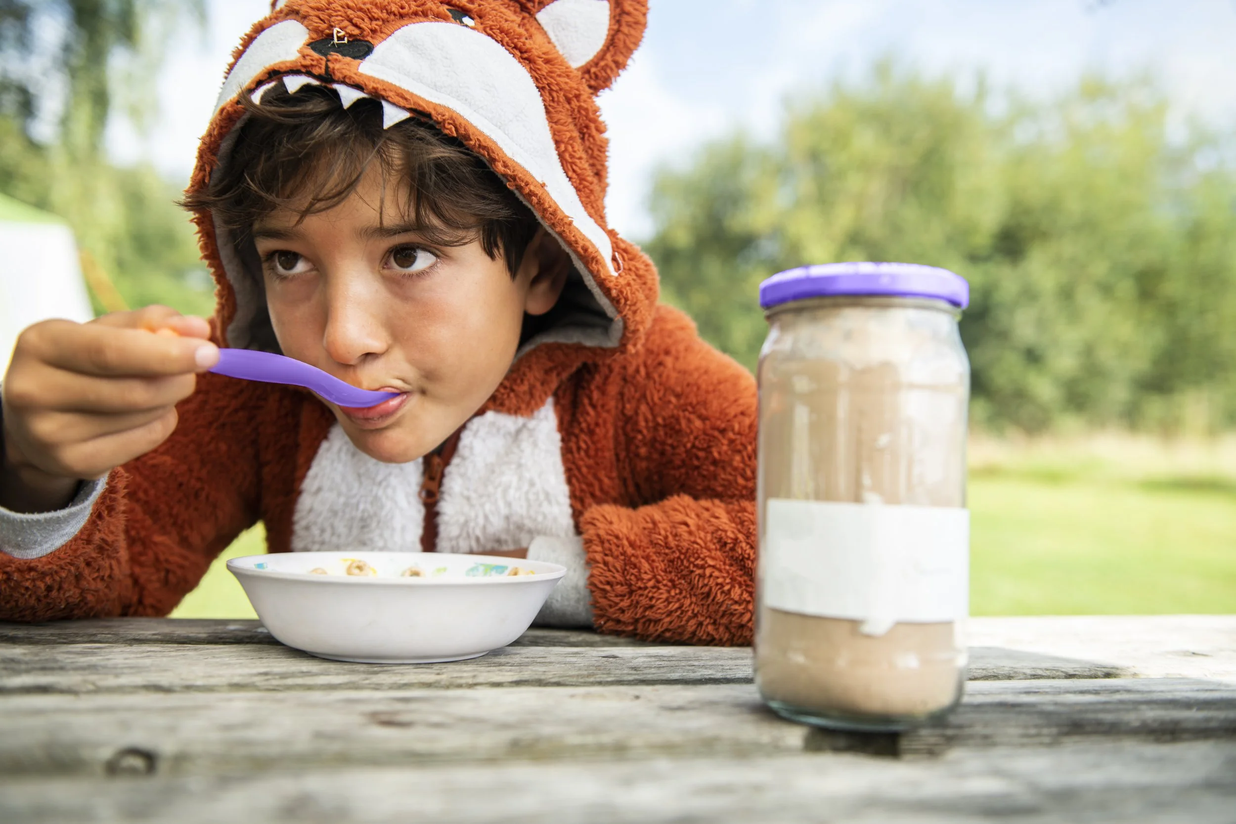 Kid in Costume Eating Cereal.jpg