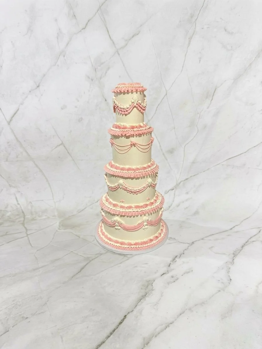 White and Pink Vintage Four Tiered Quinceañera Cake