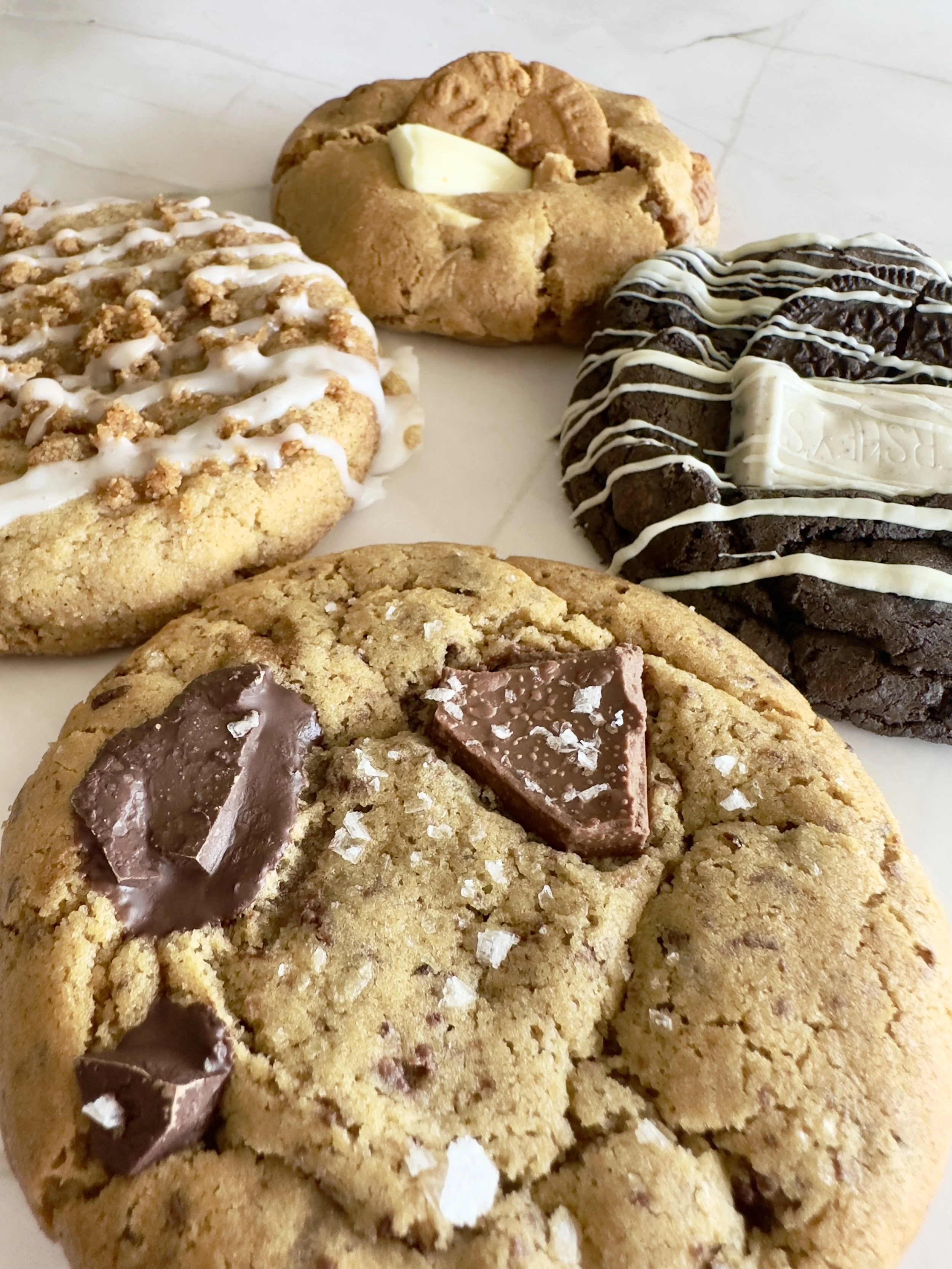 August 2026 Cookie Box Set: Brown Butter Chocolate Chunk with Flaky Sea Salt, Black Cocoa Cookies & Creme, Cinnamon Streusel Coffee Cake, and Brown Sugar White Chocolate Biscoff (Cookie Butter)
