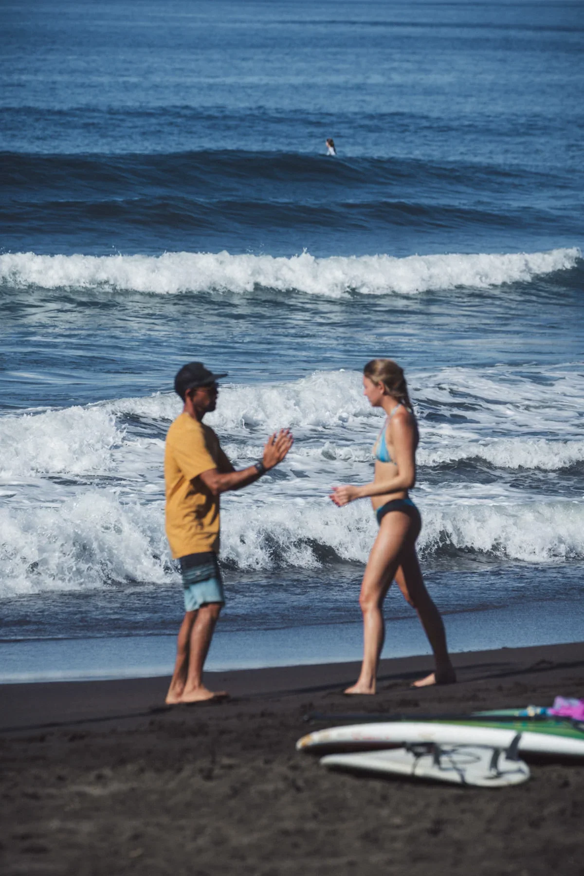 Surf coach working one on one with a student during a surf training program in Costa Rica