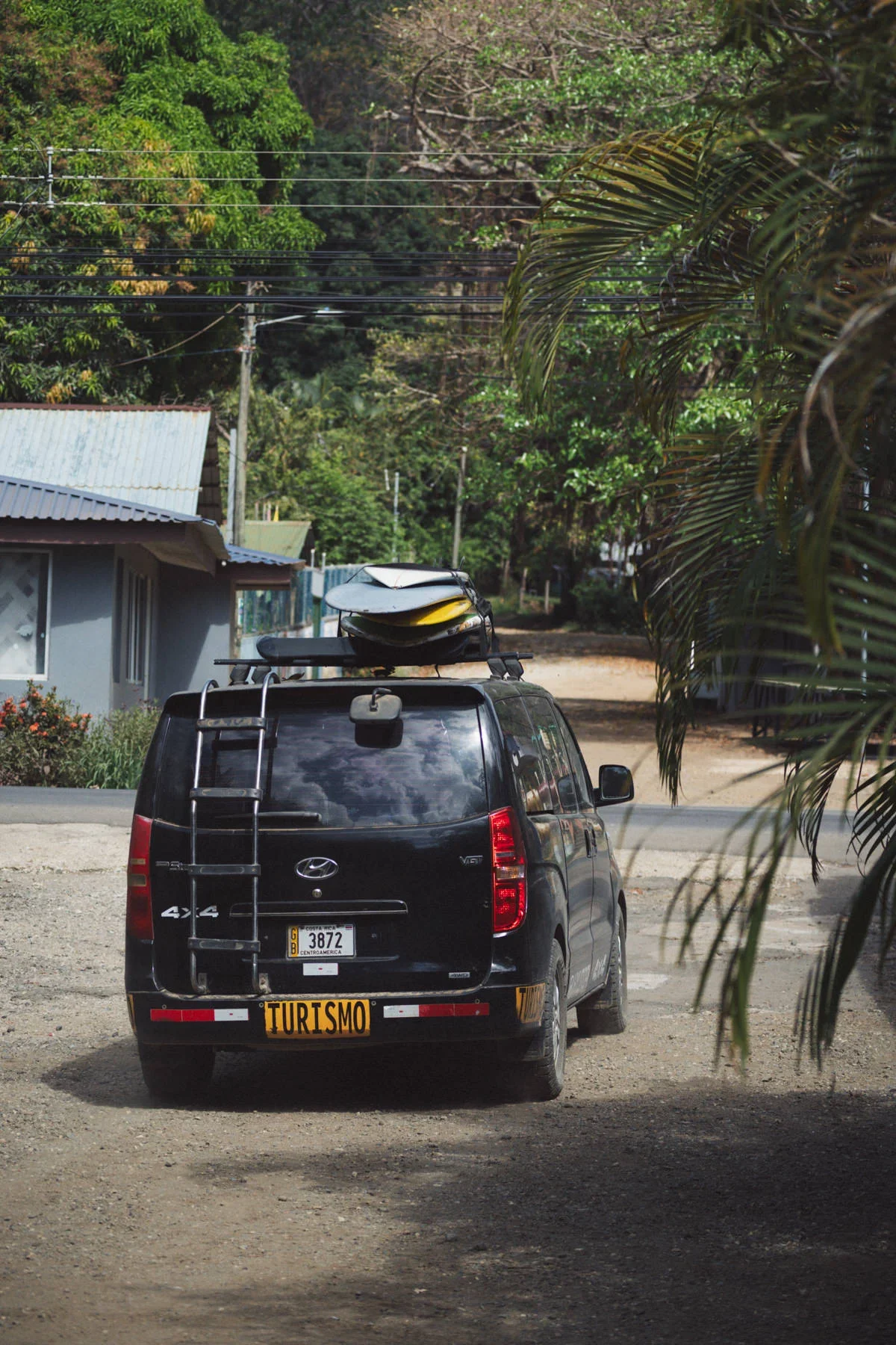 Van loaded with surfboards ready for a guided surf trip along the Pacific coast of Costa Rica
