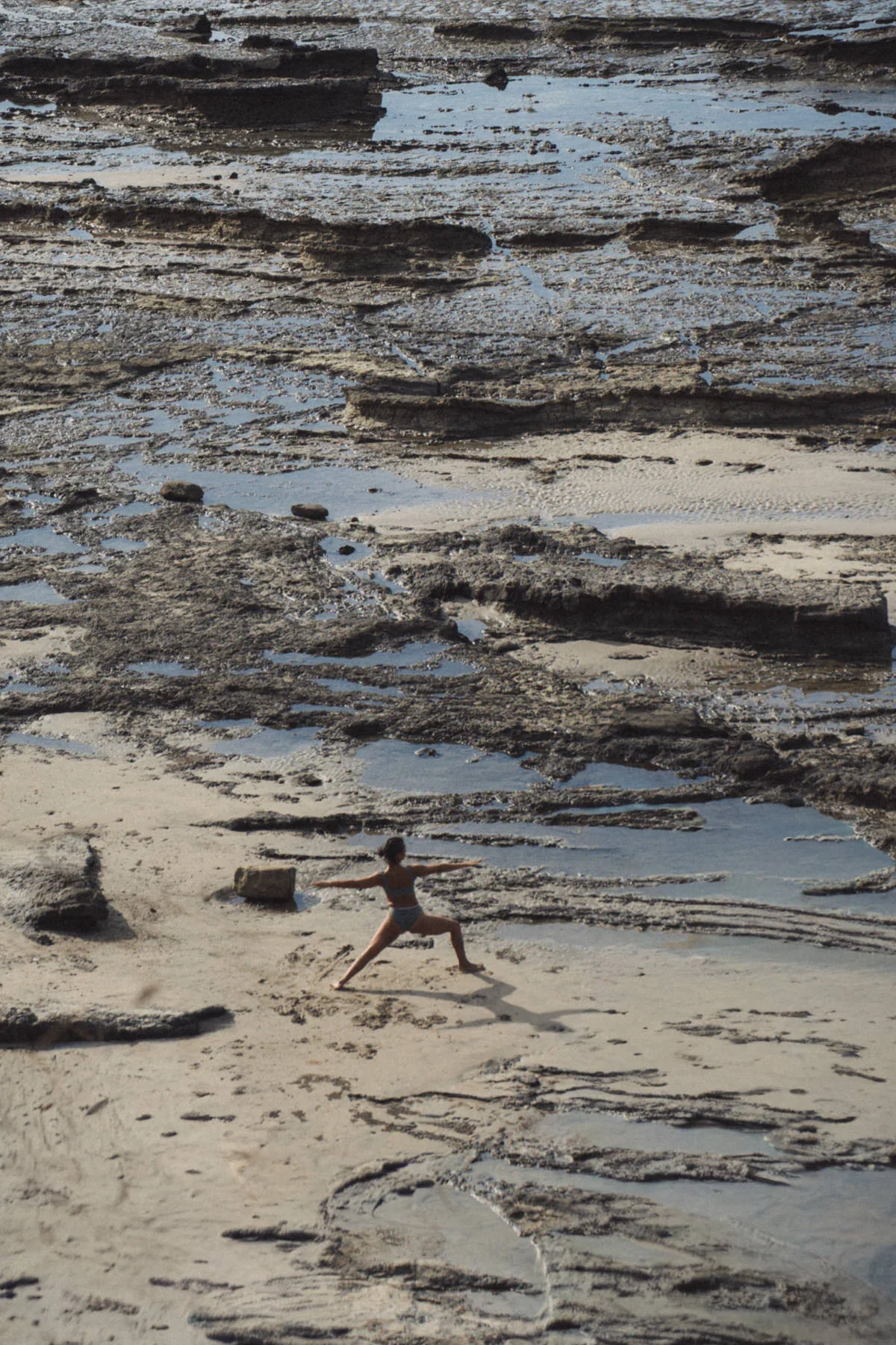 A woman on the Playa Guiones Nosara doing yoga