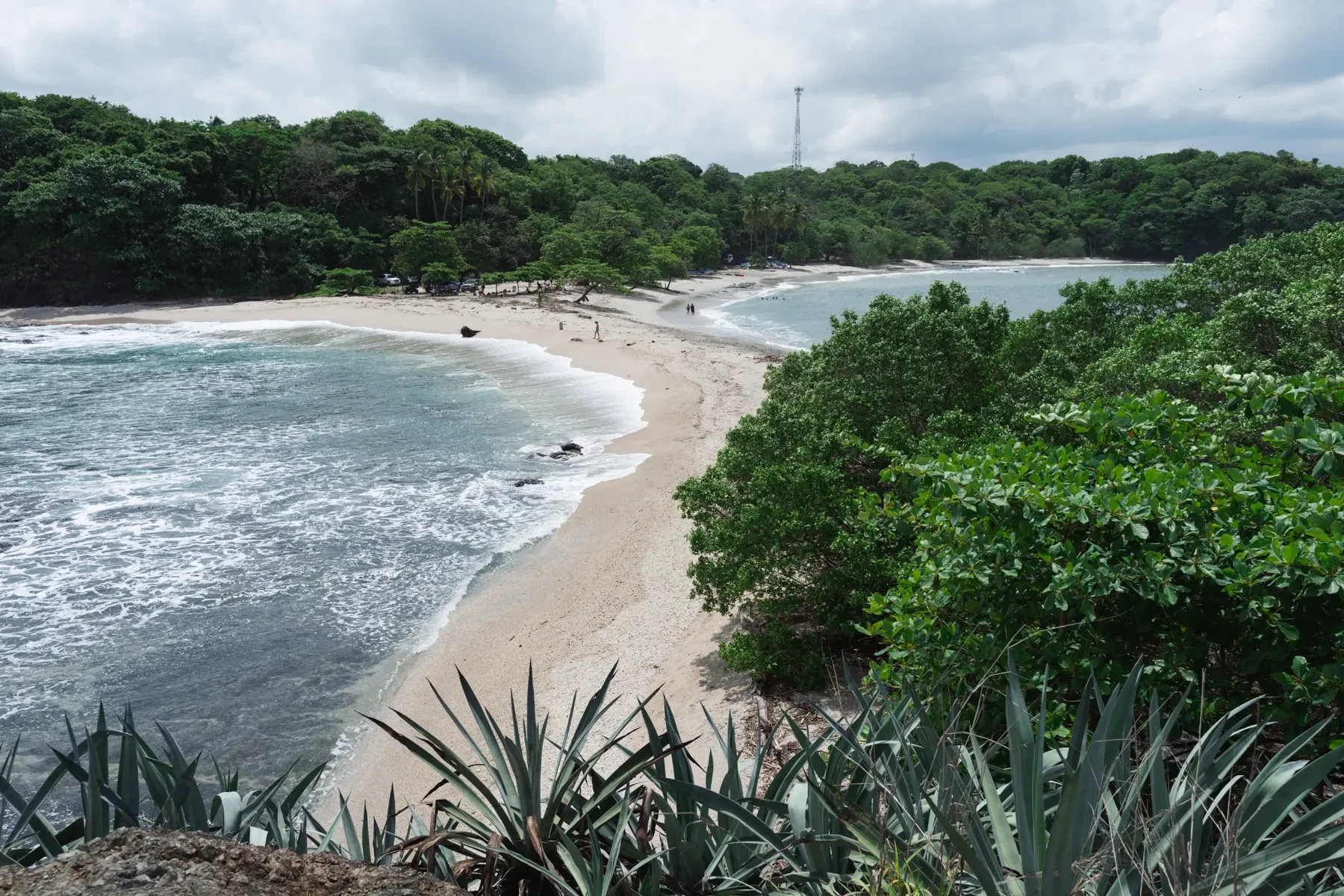 View of Playa San Juanillo Costa Rica, white sand and clear waters, popular snorkeling spot.