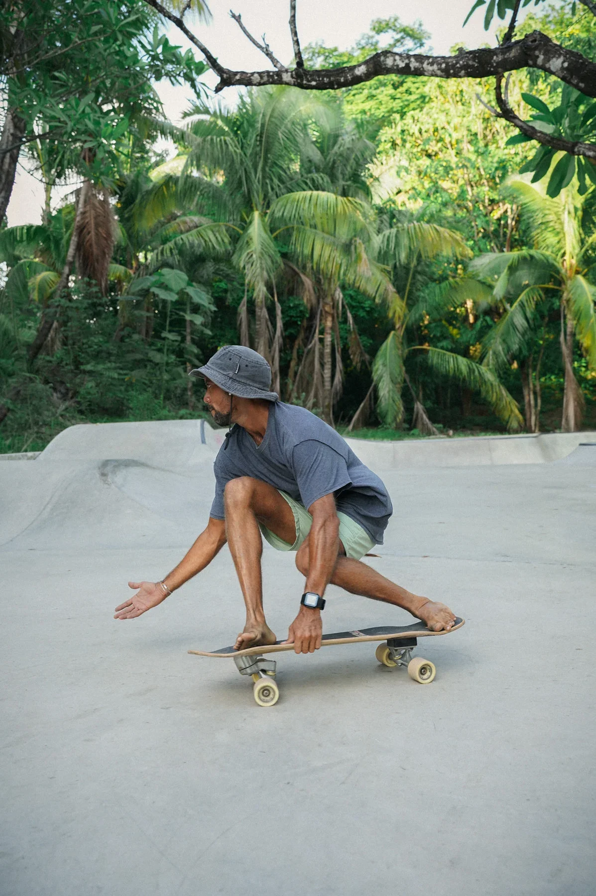Surf Skate Instructor doing a surf maneuver in Guiones, Costa Rica