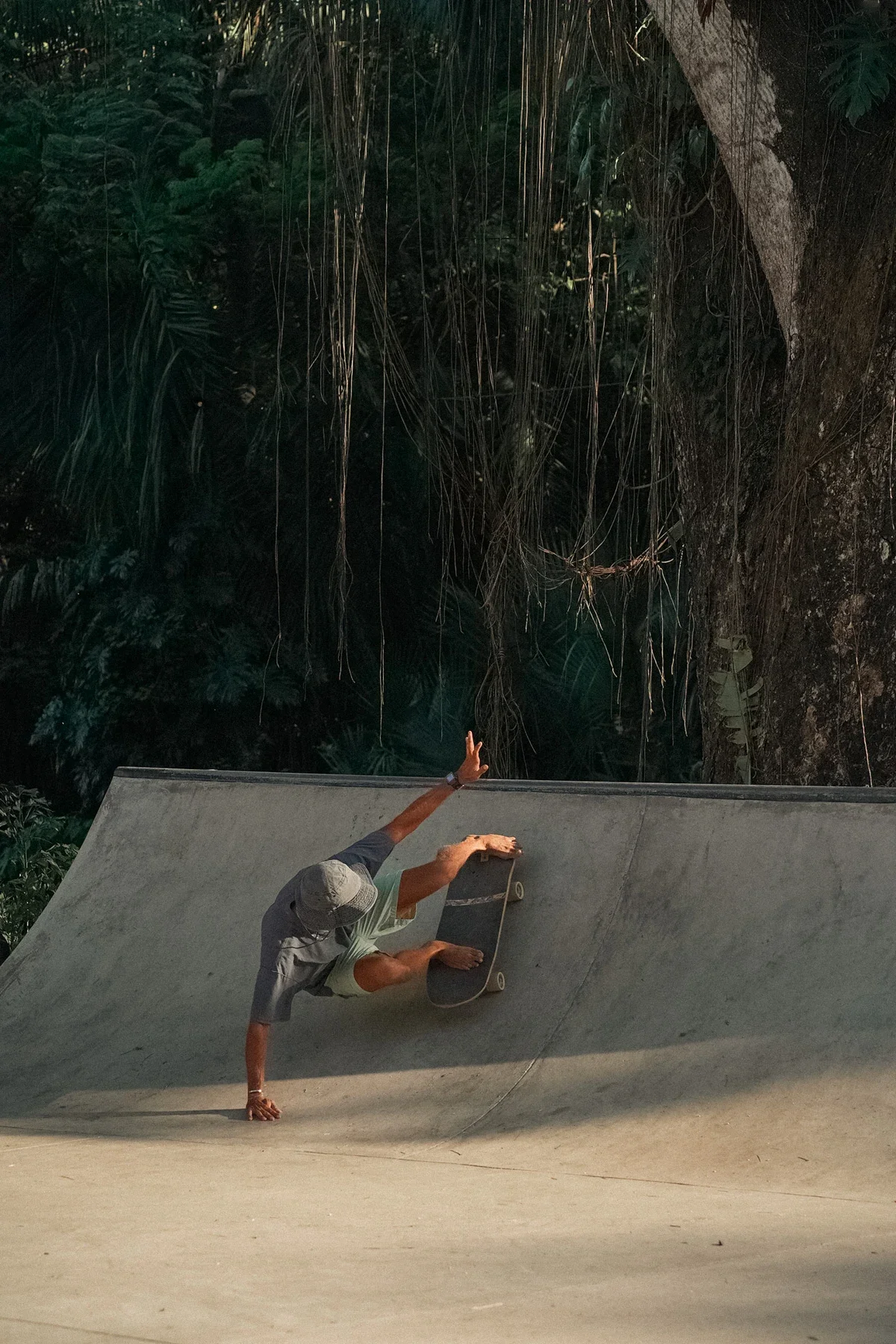 Surfer practicing surf skate maneuvers at Guiones Skatepark in Nosara Costa Rica.