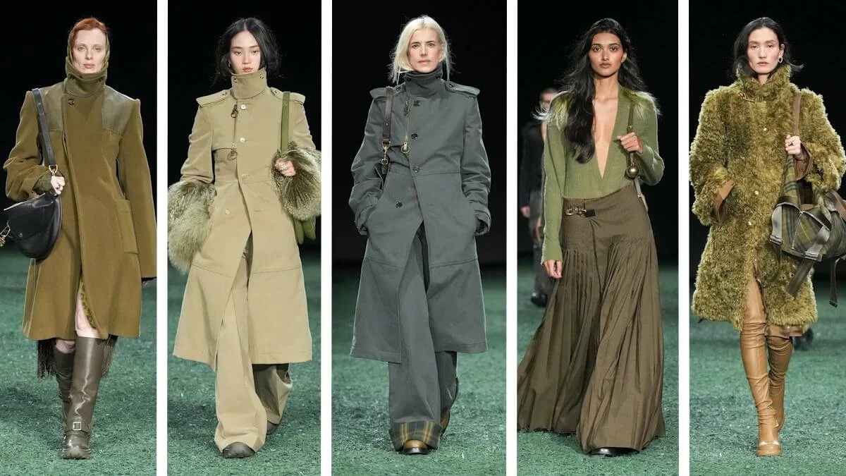 Models walking in a fashion show wearing various green-toned outfits, including coats, long skirts, and boots, against a dark background.