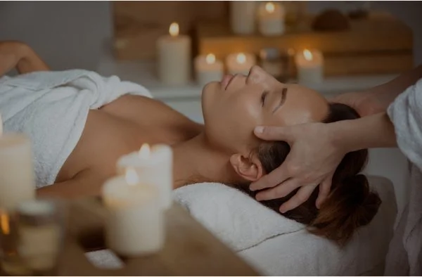 Woman receiving a scalp massage at a head spa