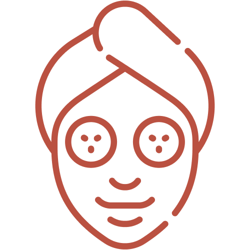Line drawing of a person's face with a towel wrapped around the head and two facial masks on cheeks, smiling.