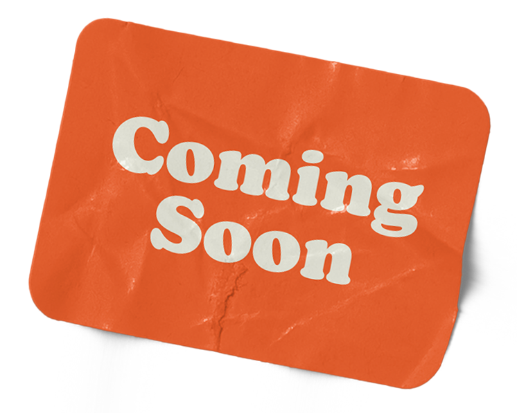 A rectangular orange sign with white bold letters that read "Coming Soon."