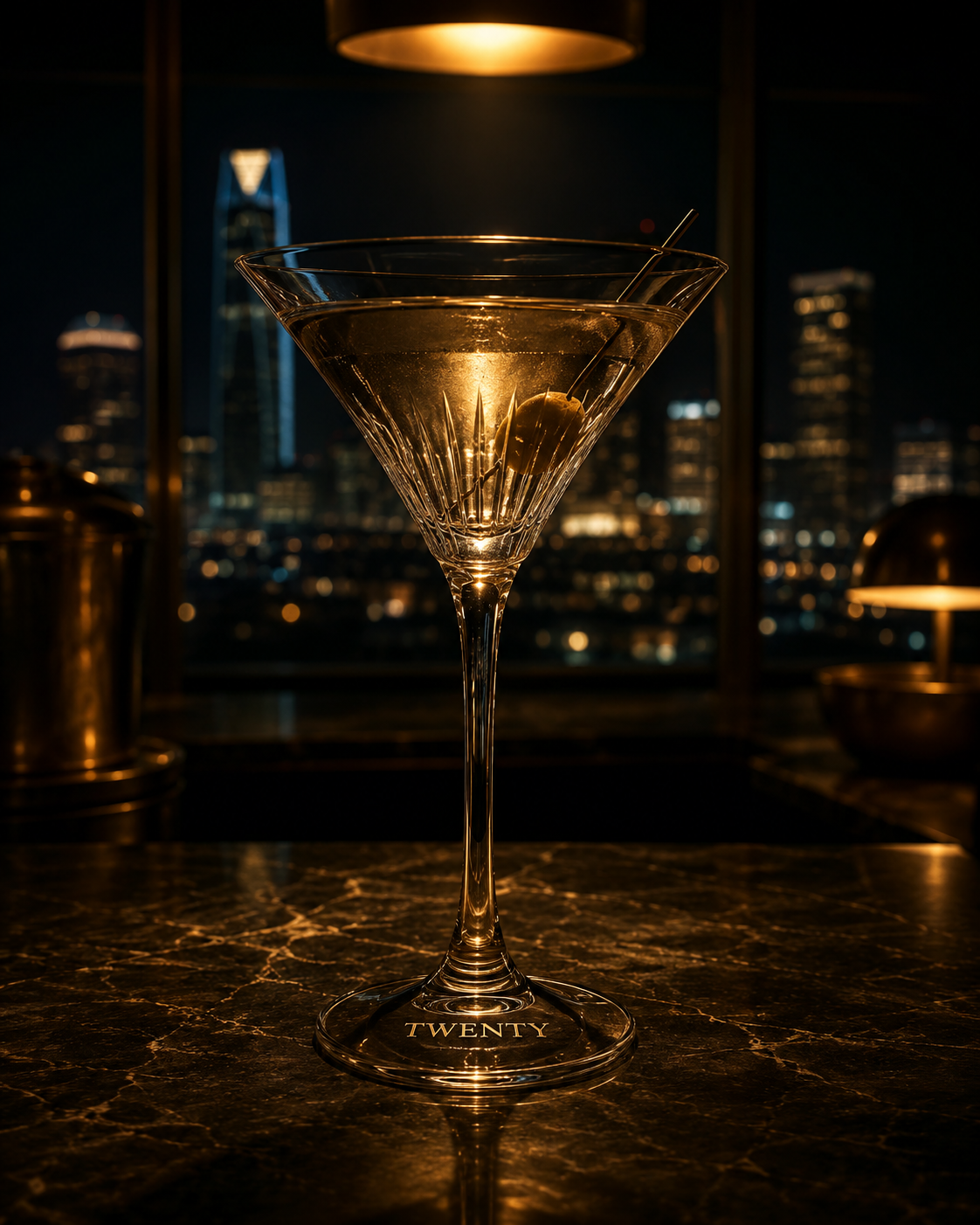 A cocktail in a glass on a bar counter with blurred background.