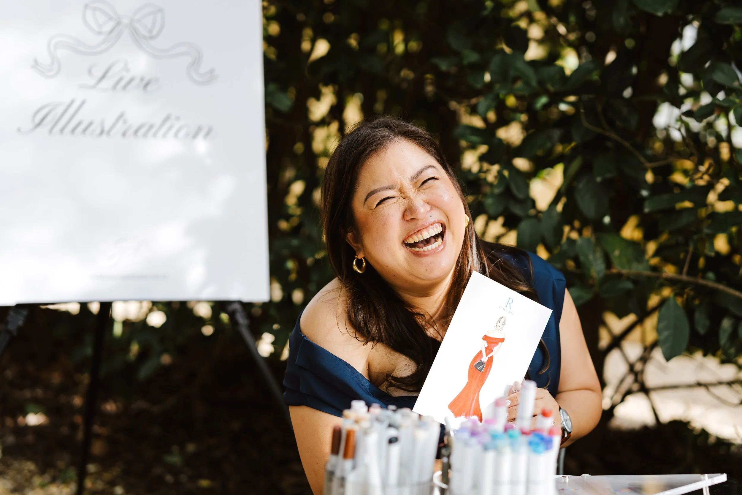 Live wedding illustrator sketching guest portraits in real time during a celebration