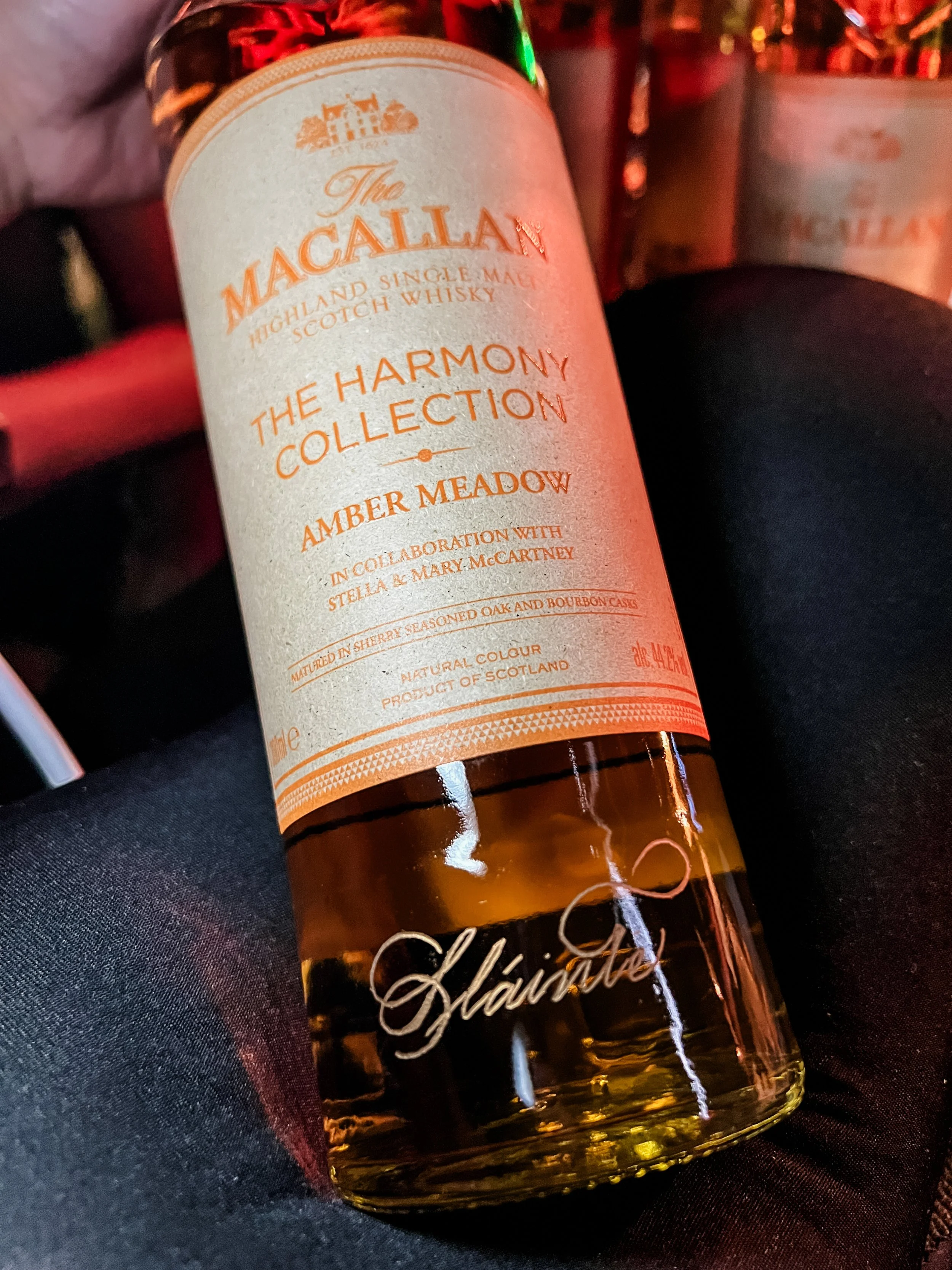 live calligraphy engraving on Macallan whiskey bottle at a luxury product launch in Sydney