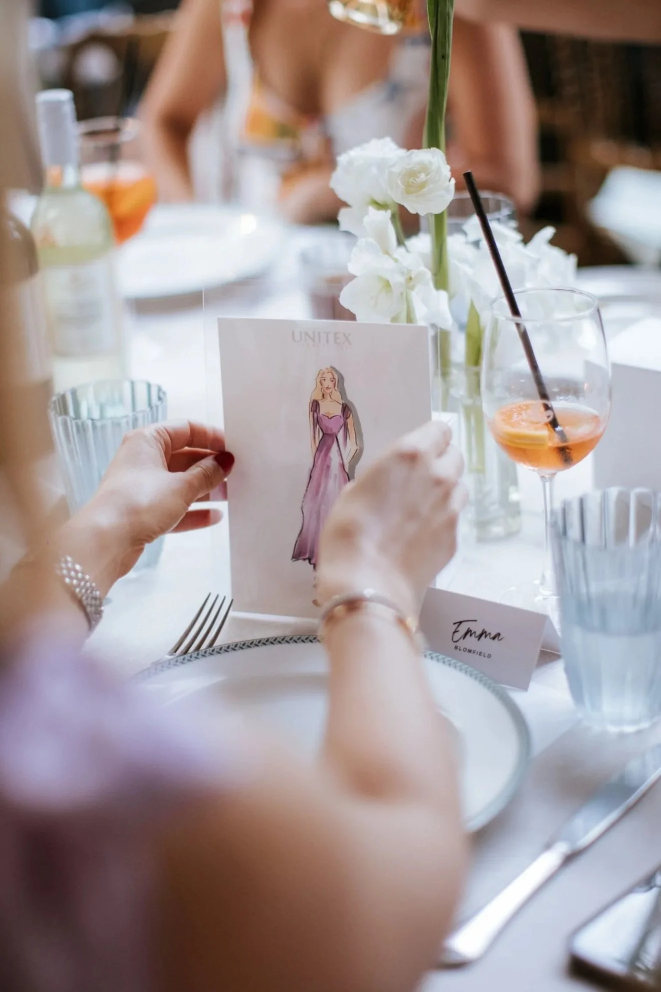 guest holding live fashion illustration sketch at brand event in Sydney