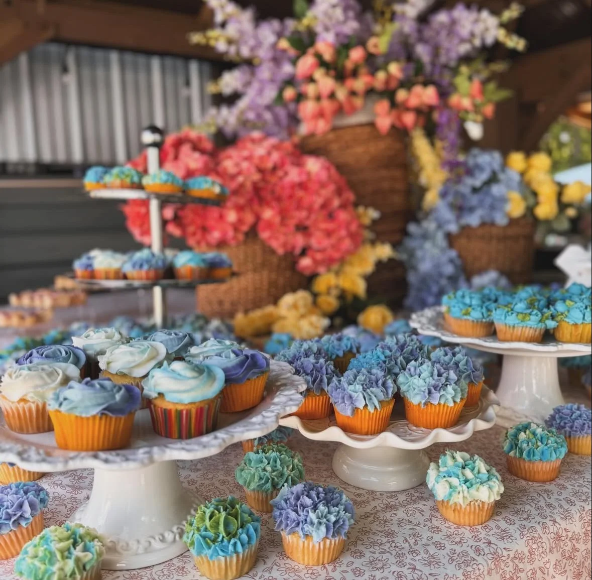 Elegant dessert table featuring assorted cookies, pastries, and sweets displayed on tiered stands at a luxury event.