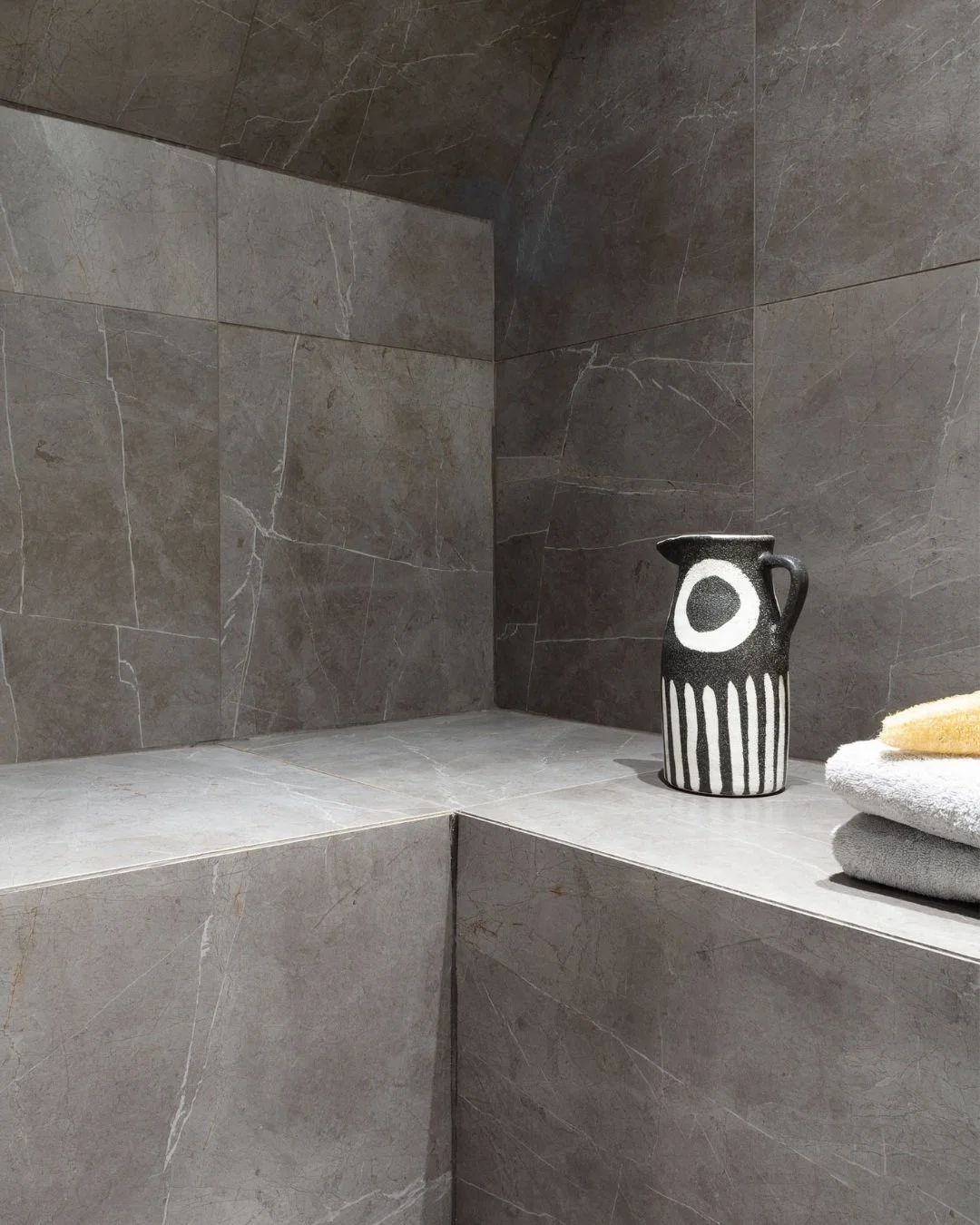 It goes without saying, I love natural stone! It sets the benchmark for high-end floors and walls, but it comes with trade-offs: cost, weight, porosity, upkeep. Now large format stone-effect tiles are becoming an increasingly viable alternative thank