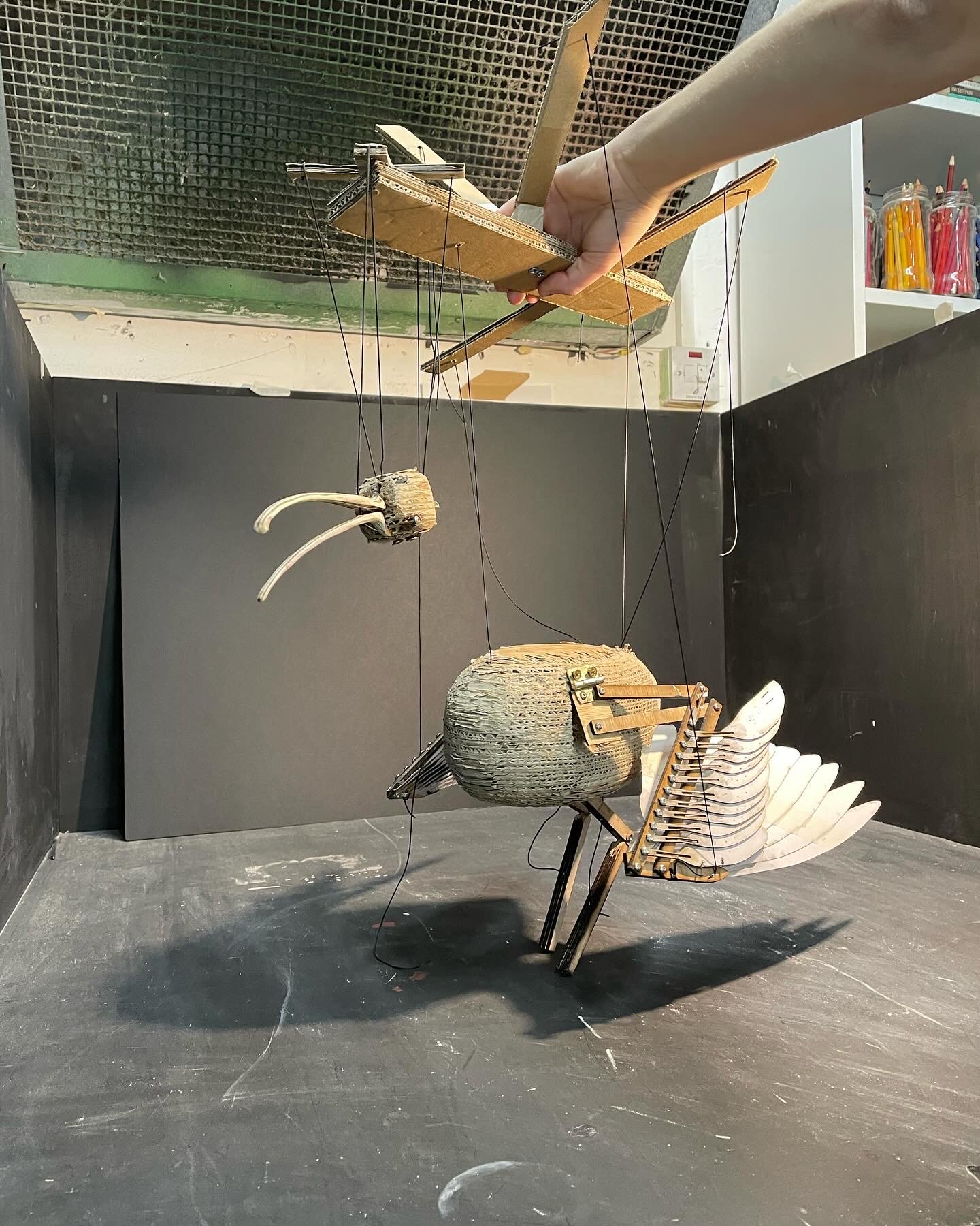Maquette carved out of layered cardboard.