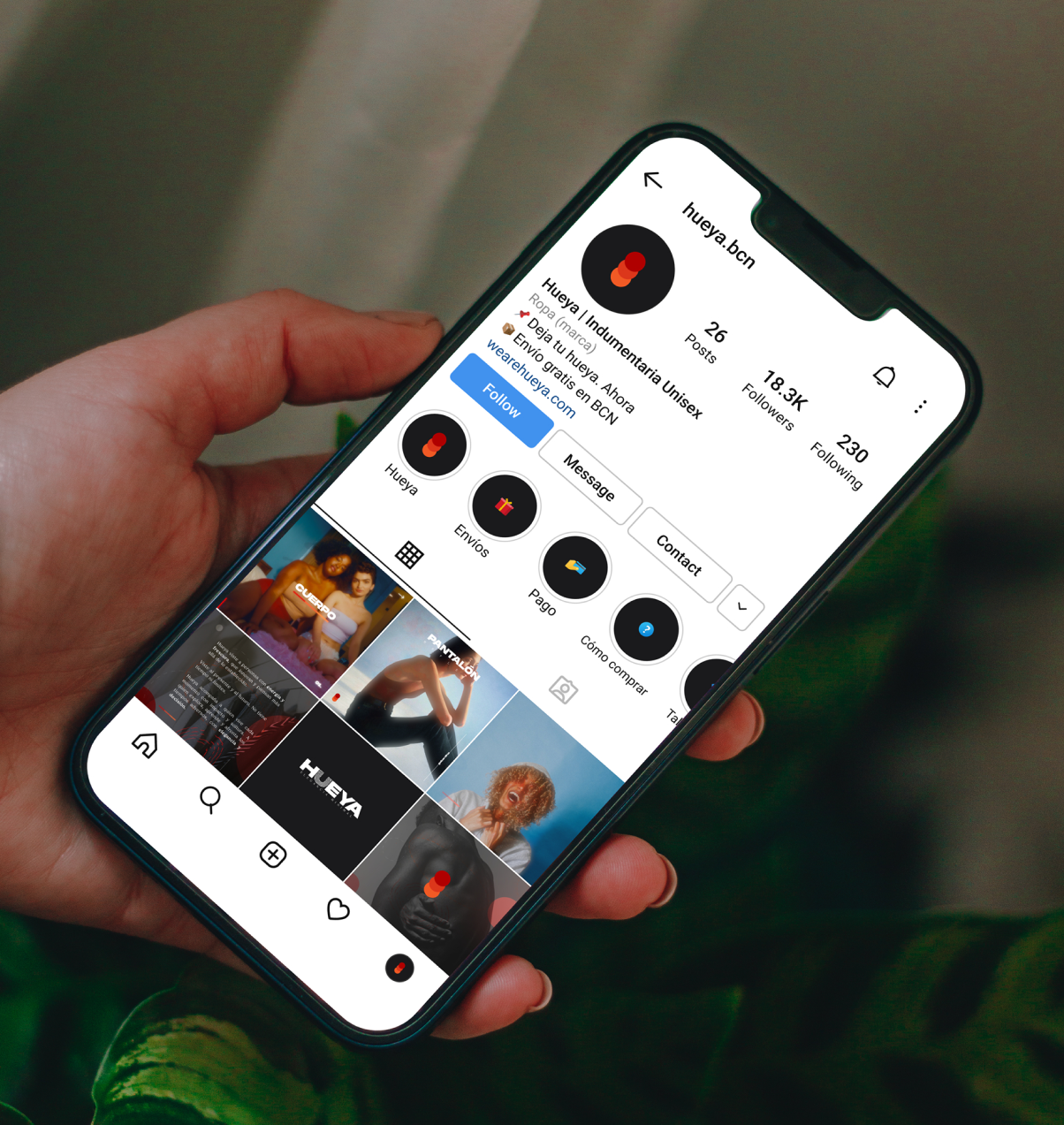 Man holding an iPhone 13 mockup (Mockuuups Studio).png