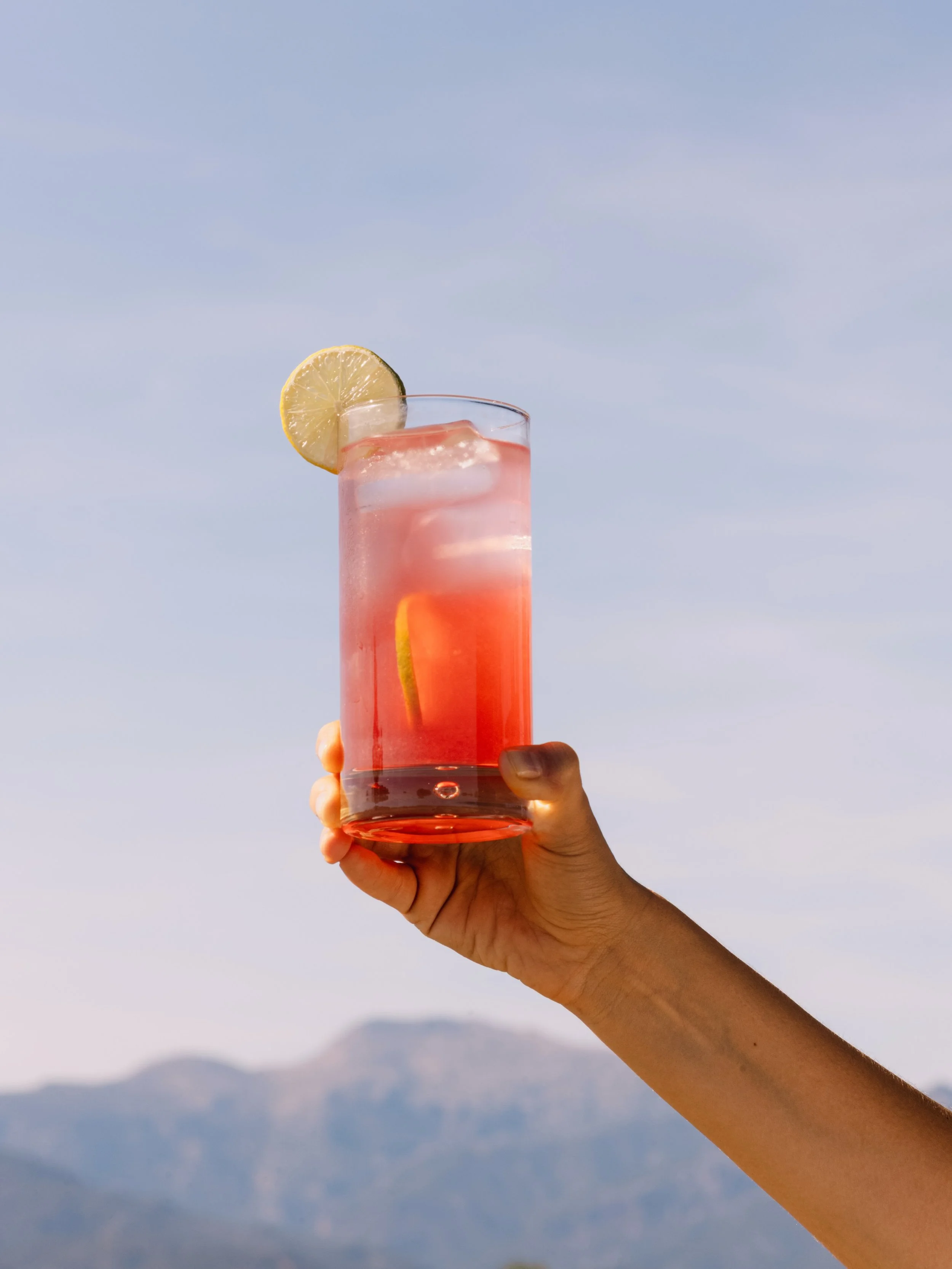Equal parts Amarg&eacute;ro, white rum and fresh grapefruit juice, a squeeze of lime, shaken hard over ice.

We call it the Sunset Breeze, for reasons that become obvious around seven in the evening. Make one at home, or let us make it for you at Ama