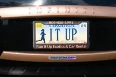 A parking permit sticker that says "IT UP" with a small person icon and the text "Run It Up Exotic & Car Rental".