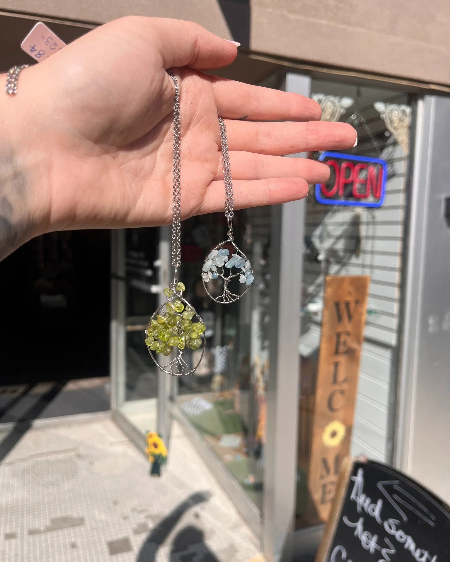 I think my favorite summer shift activity is taking our sparkly things and bringing them into the sun! 

Check out our new hand wrapped wire tree of life pendants made by our very own Gail!