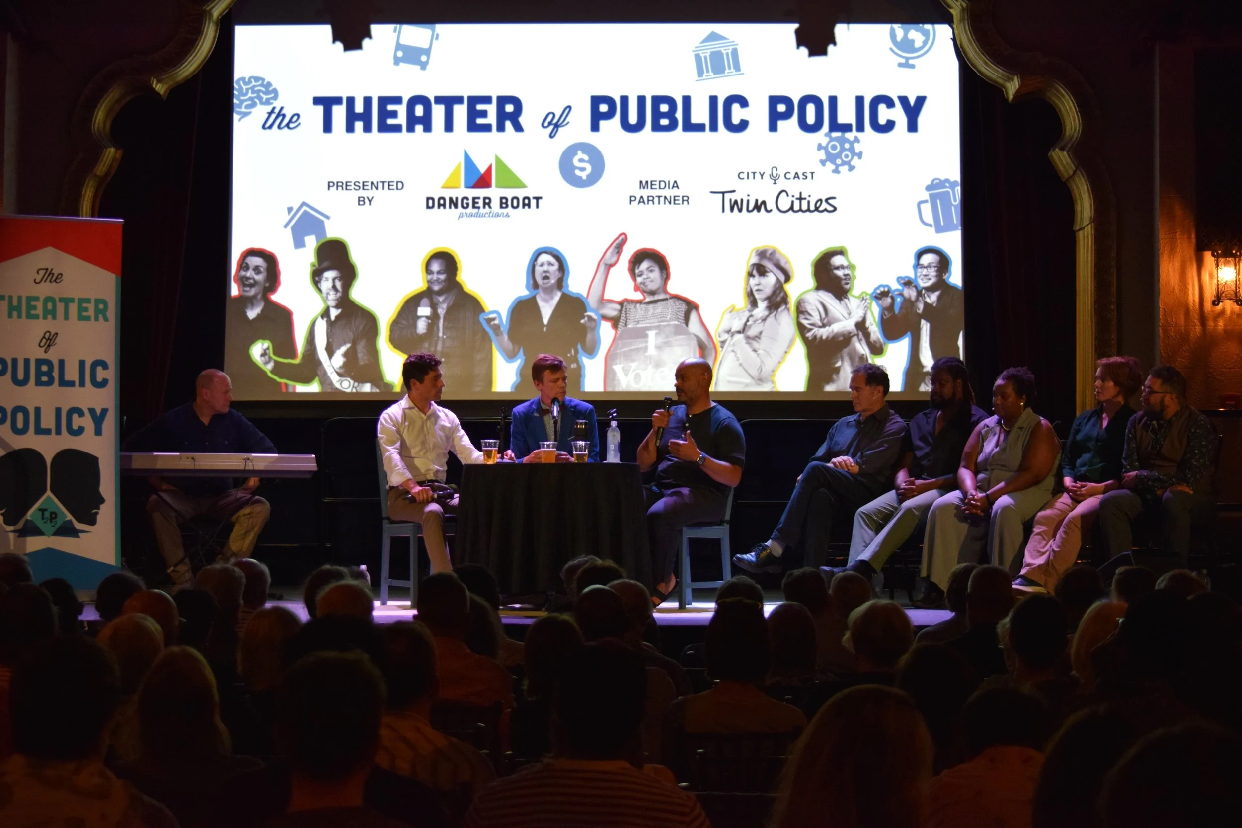  Danger, Elliott, and Payne onstage along with the cast of  The Theater of Public Policy . 