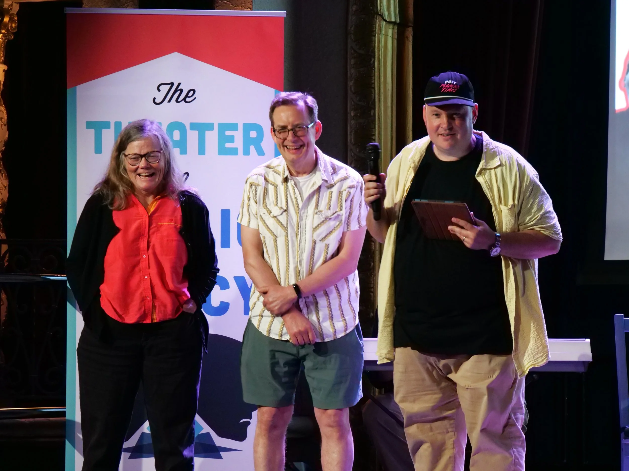  City Cast’s Sean McPherson (right) does some onstage trivia with two volunteers from the audience. 