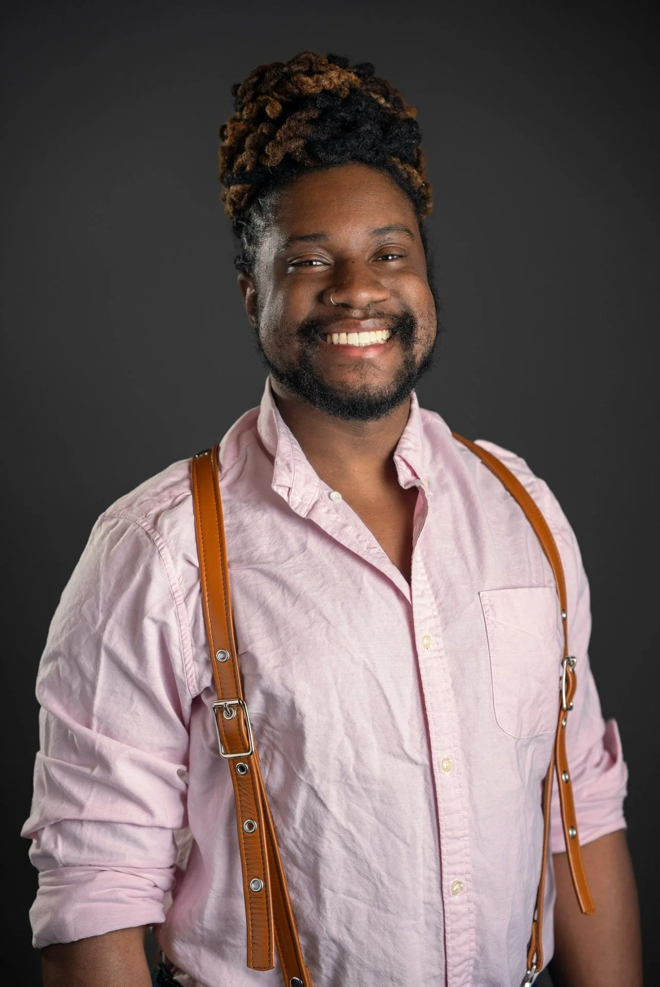Actor Denzel Belin on a gray background