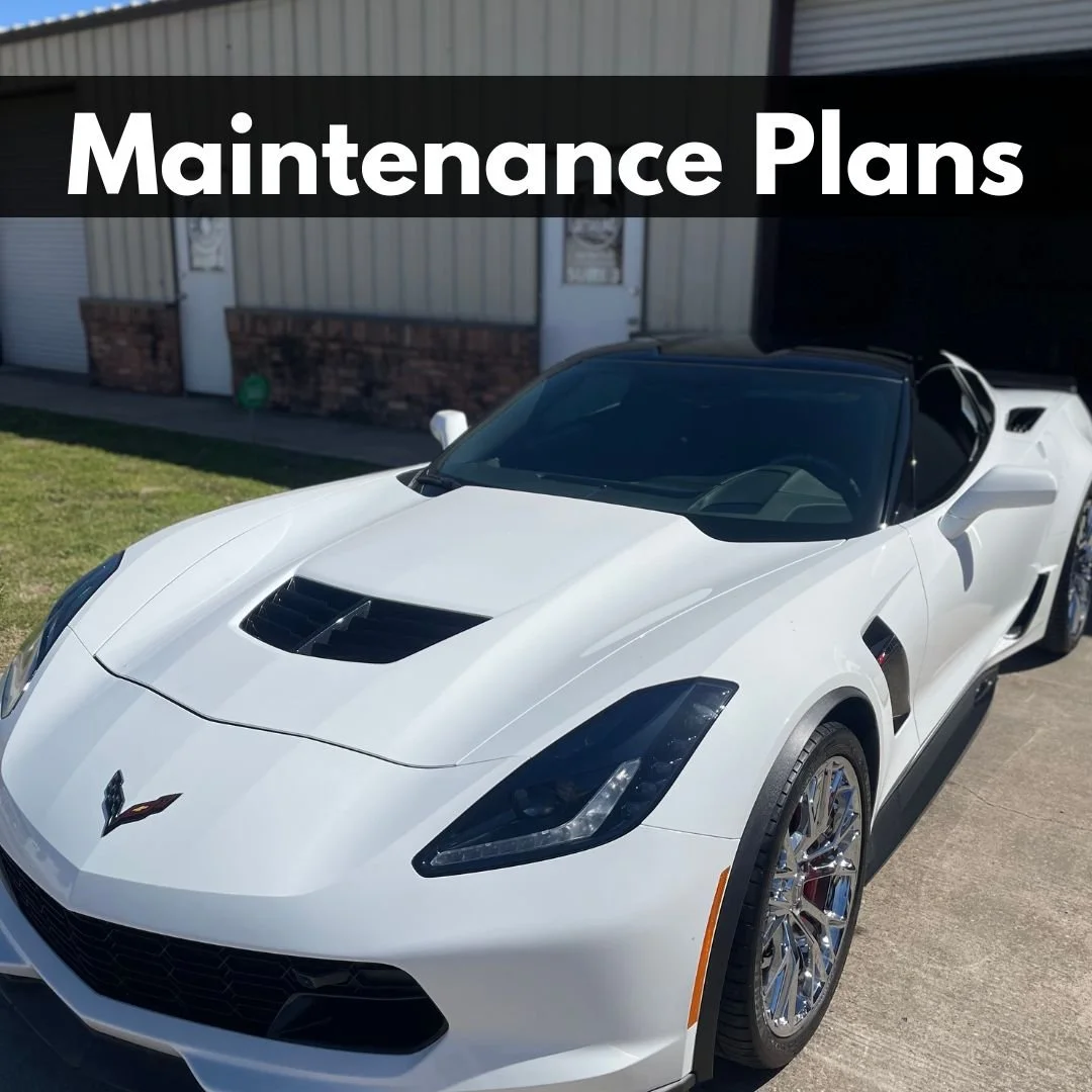 White sports car parked on driveway with a garage in the background and the text "Maintenance Plans" overlayed.