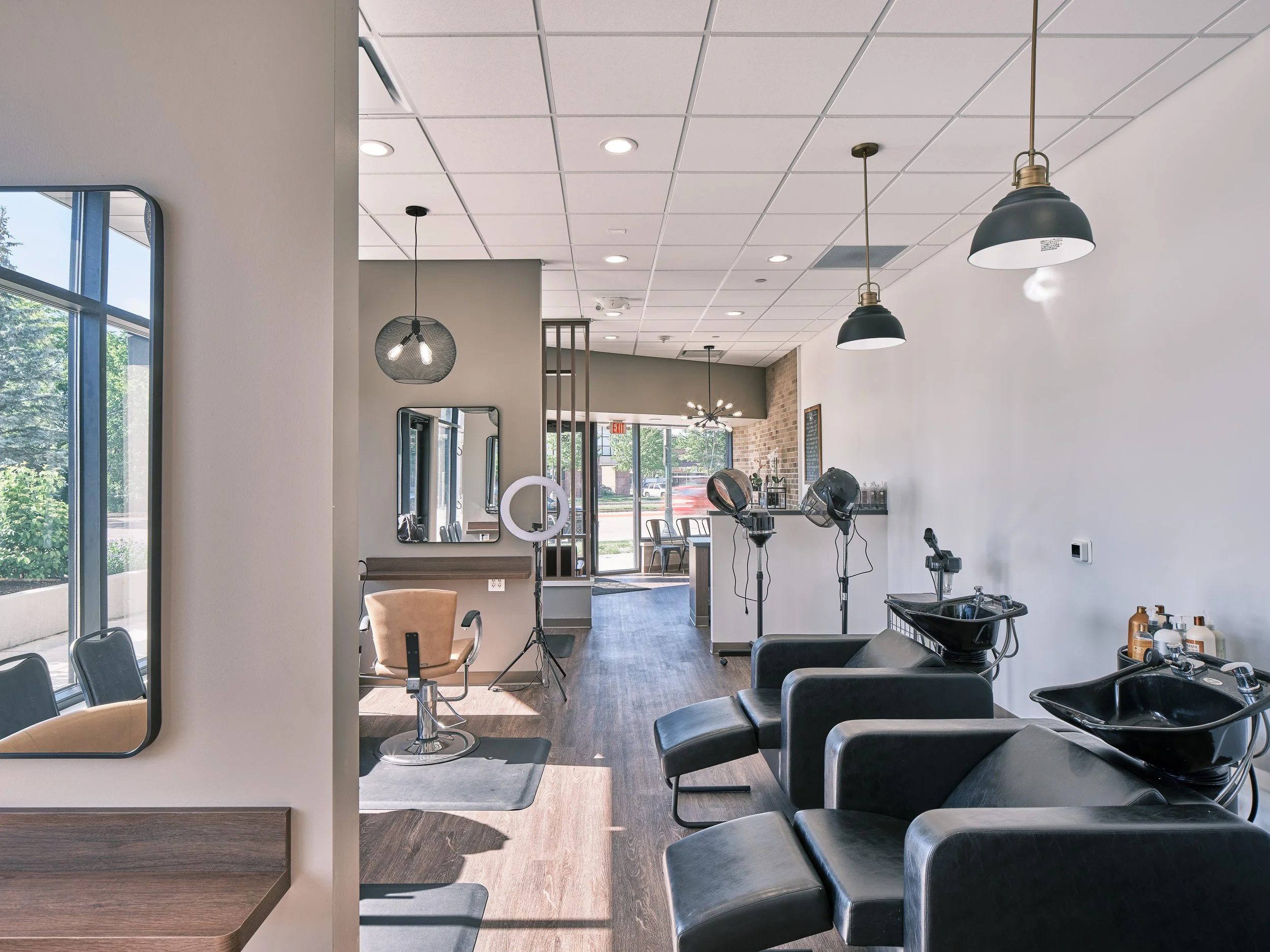 Hair washing stations in a brightly lit salon space.