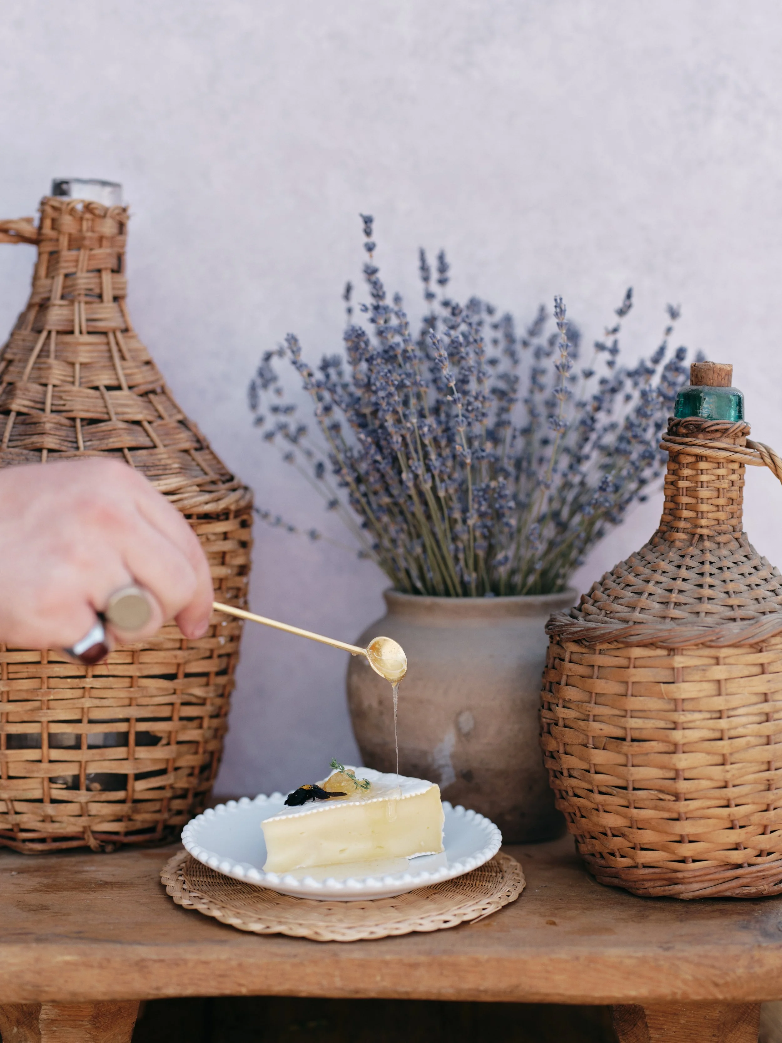 food styling with dried lavender and cake on Chasing Stone Lavender Quartz backdrop for product photography
