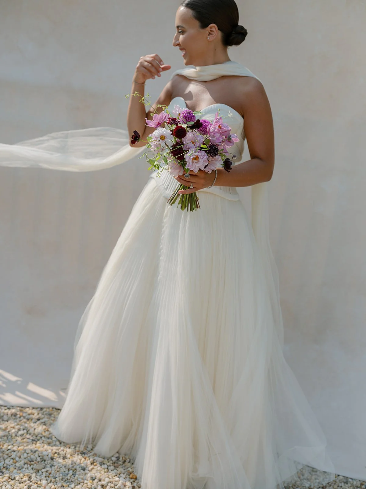 Full-length bridal portrait holding bouquet demonstrating posing on an 8x14 photography backdrop