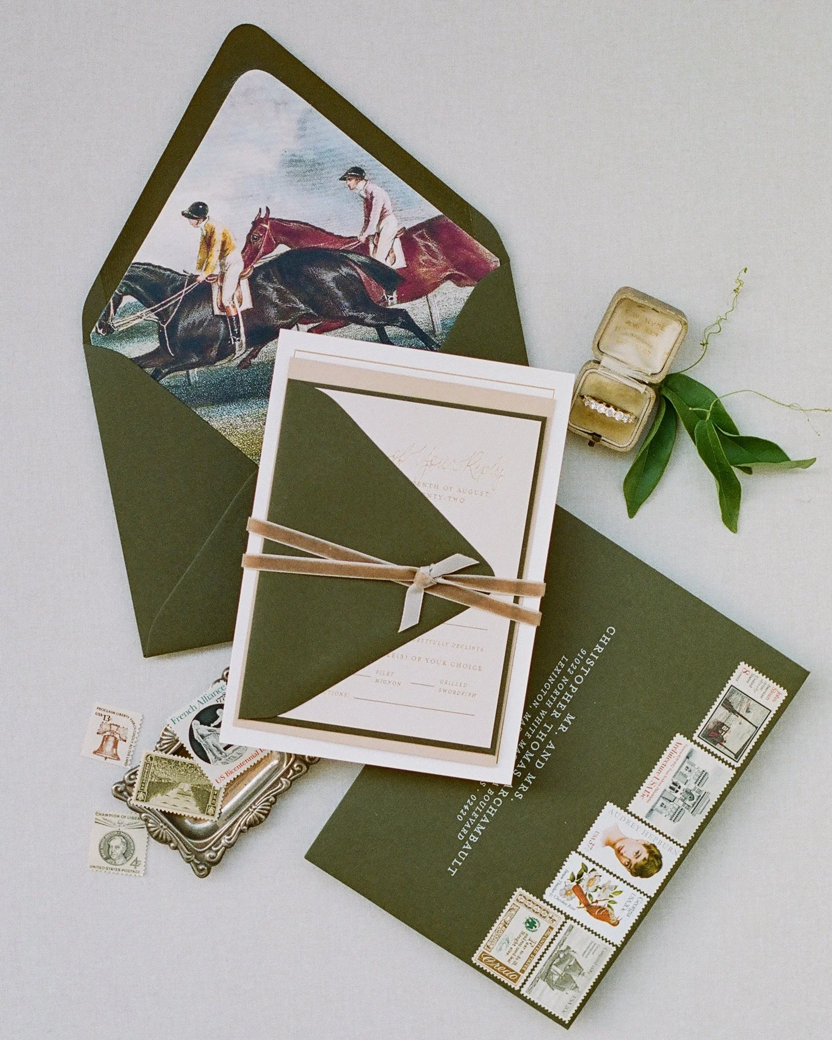 Wedding flat lay photography demonstrating negative space with equestrian invitation suite on Santorini white styling surface showing 60/40 composition rule