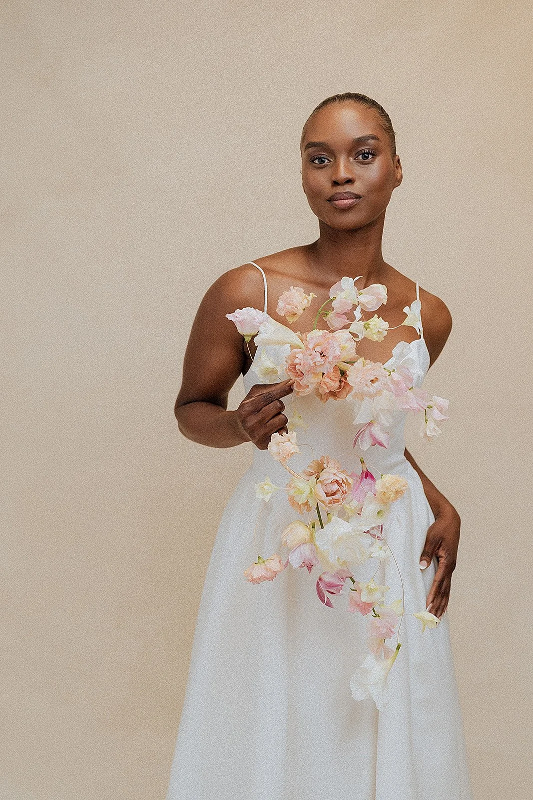 Editorial bridal portrait with floral styling photographed on an 8x14 photography backdrop