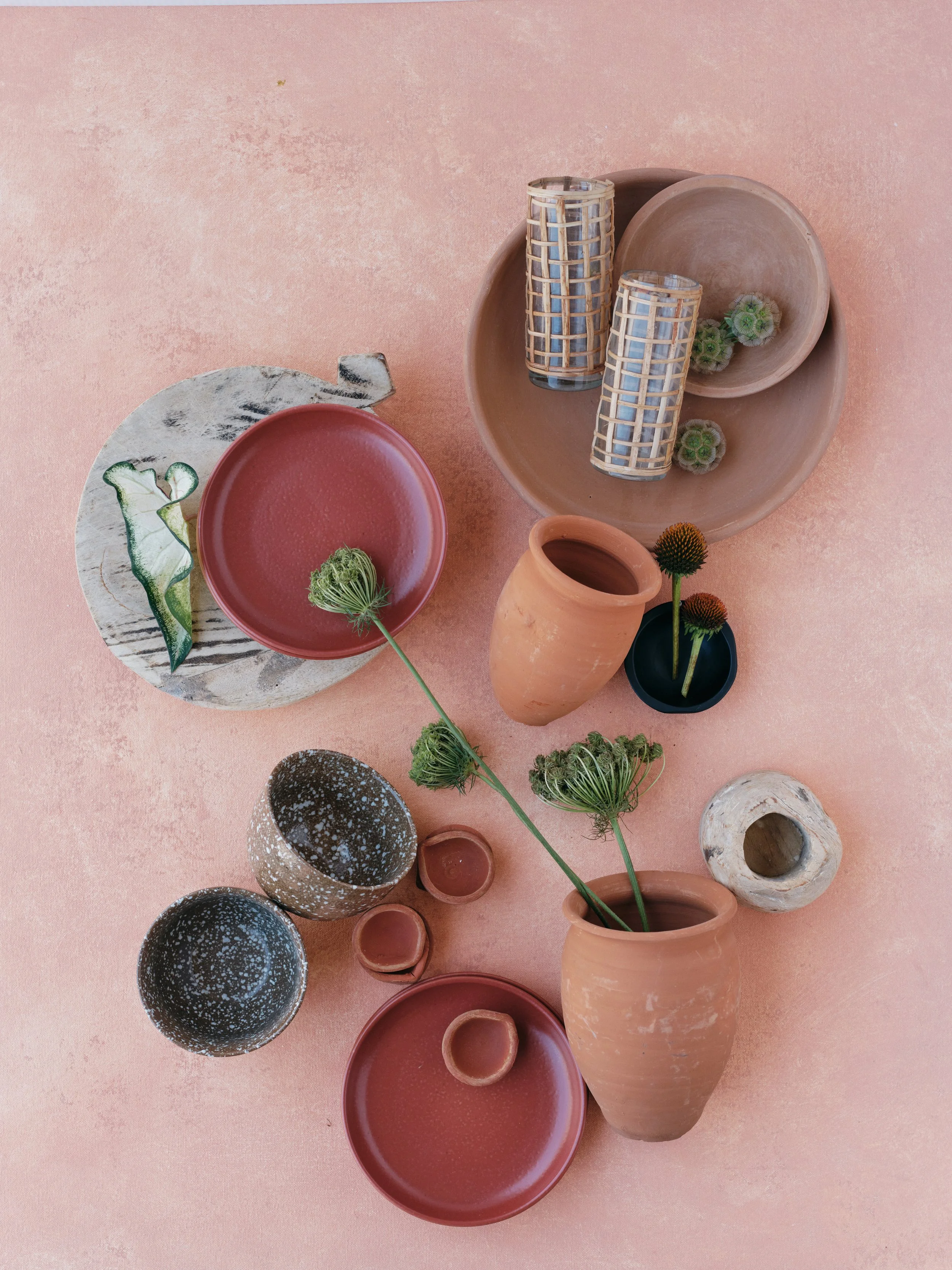 haleakala hand-painted pink canvas backdrop with styled flat lay product photography featuring pottery and flowers