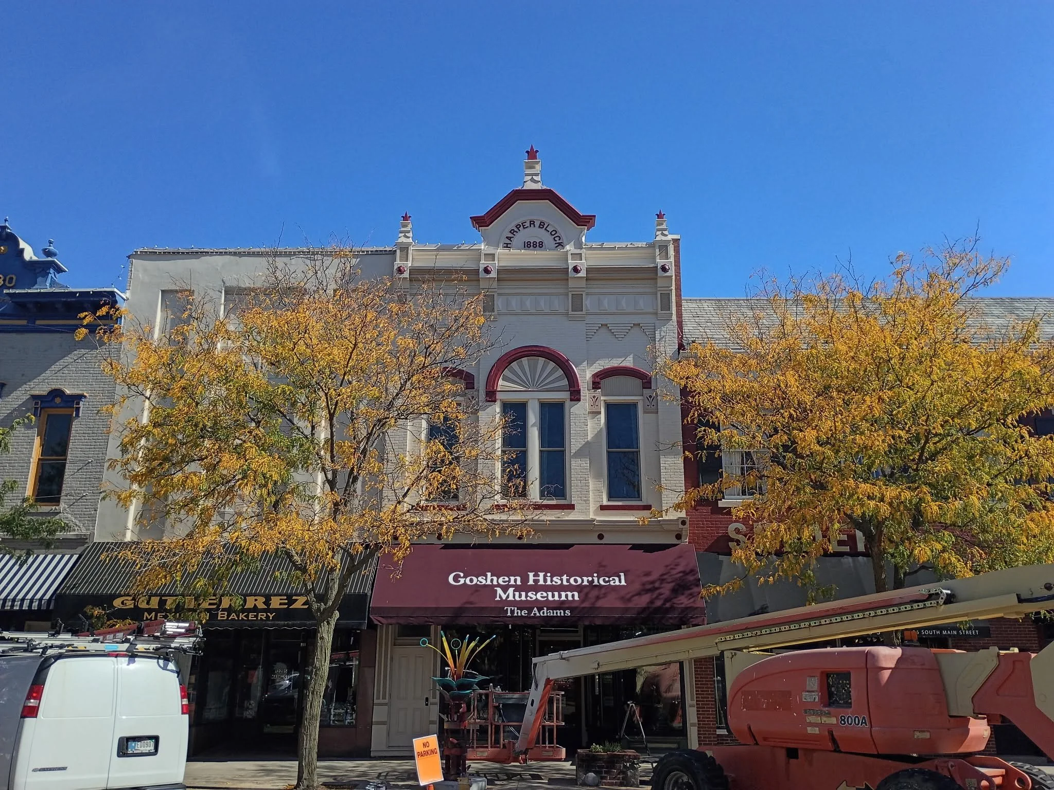 Goshen Historical Museum exterior with a boom lift positioned along the storefront.